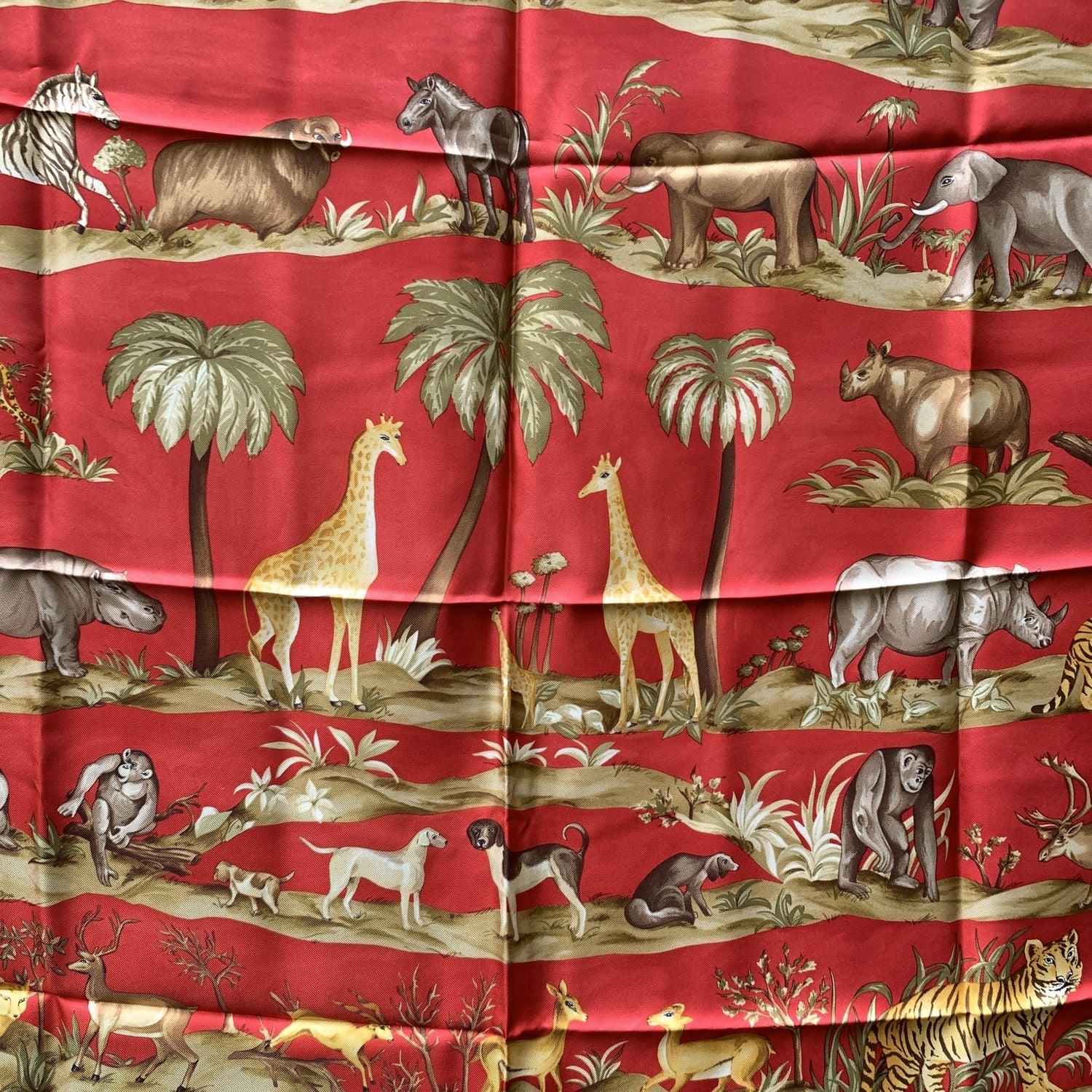 Vintage Salvatore Ferragamo silk scarf. Animal print. Red color. Hand rolled edges. Made in Italy. Composition: 100% silk. Measurements: 34.5 x 34.5 inches - 87.5 x 87.5 cm. 'Salvatore Ferragamo' signature printed on the scarf Details MATERIAL: Silk