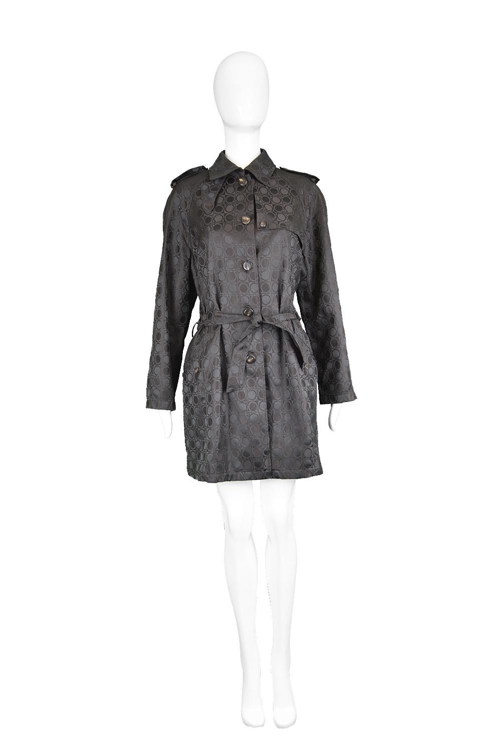 Salvatore Ferragamo Vintage Women's Black Subtly Iridescent Logo Pattern Jacquard Coat

Size: Marked I 42 / US 8 / F 40 / D 38 but this gives a loose fit like most trench coats and would best fit a medium to Large. Please check measurements