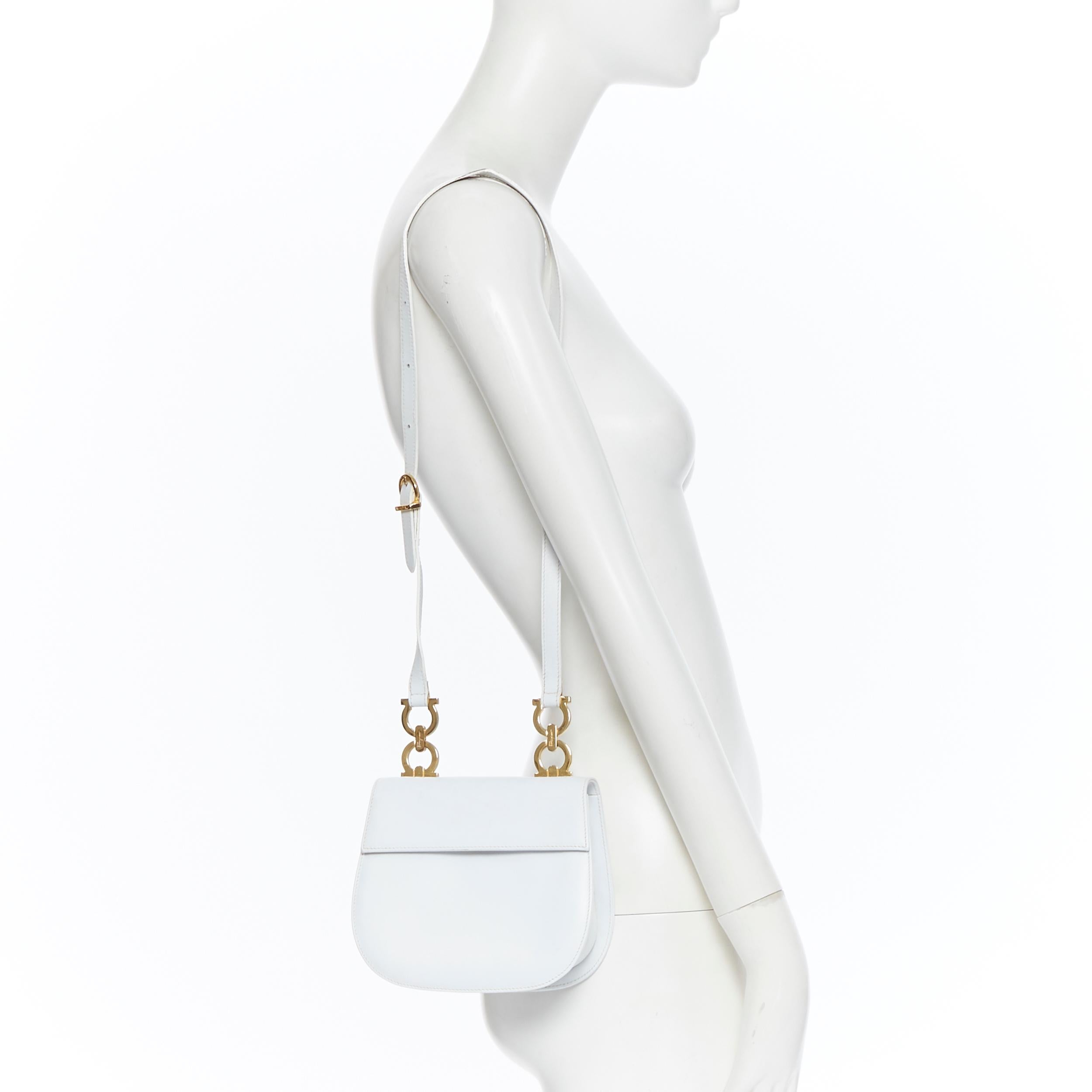 SALVATORE FERRAGAMO white leather gold hardware flap front shoulder satchel bag
Brand: Salvatore Ferragamo
Model Name / Style: Shoulder bag
Material: Leather
Color: White
Pattern: Solid
Extra Detail: Shoulder Strap.
Made in: Italy

CONDITION: