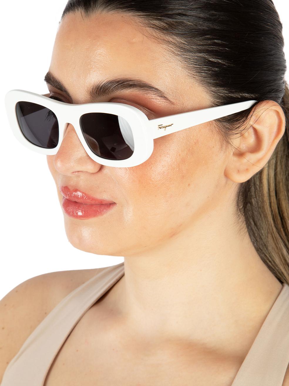 CONDITION is New with tags on this brand new Salvatore Ferragamodesigner item. This item comes with original packaging.
 
 
 
 Details
 
 
 Model: SF1046S
 
 Season: JAN2022
 
 White
 
 Acetate
 
 Rectangle Sunglasses
 
 Grey Tinted Lens
 
