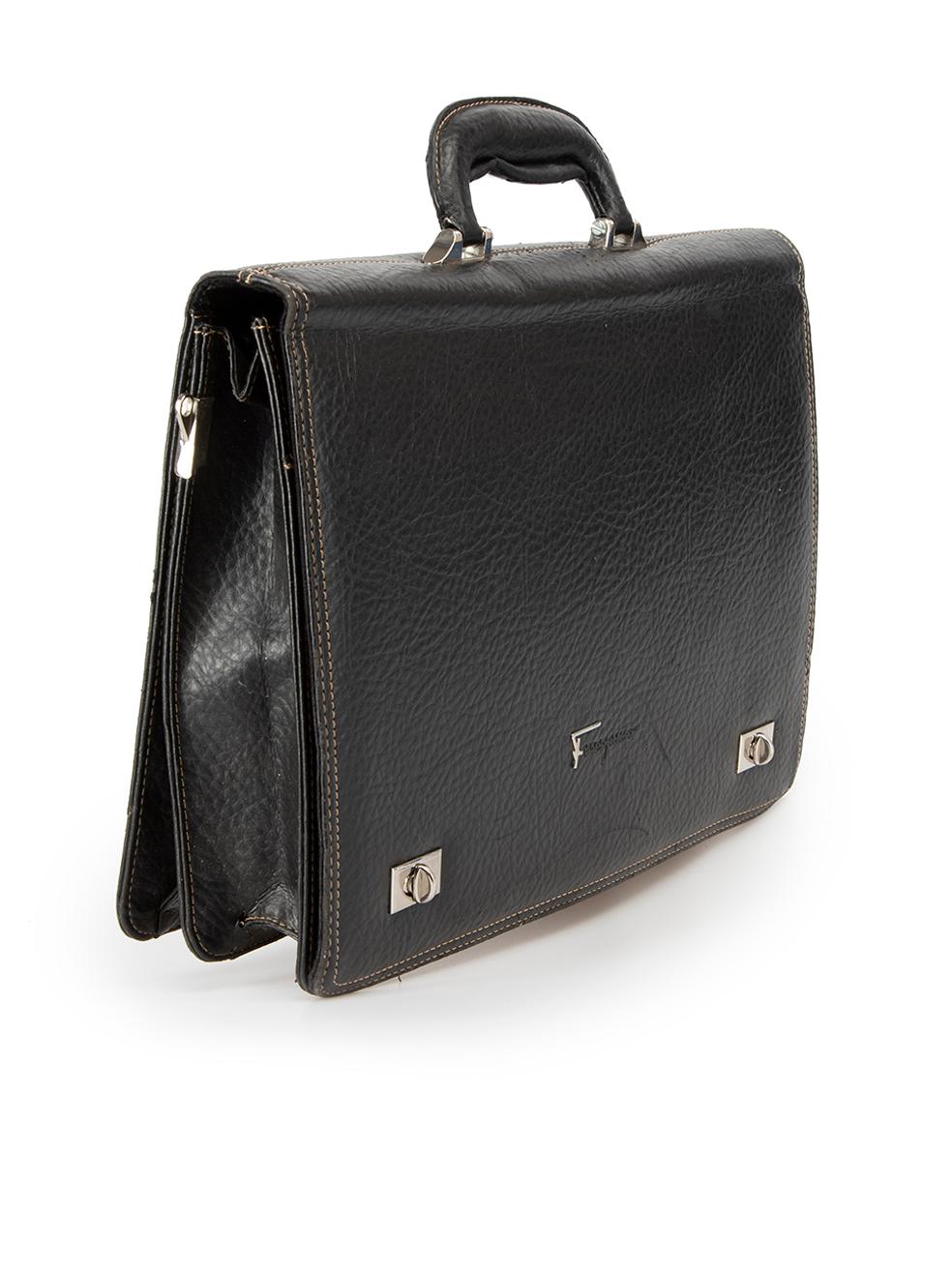CONDITION is Good. General wear to briefcase is evident. Moderate signs of wear to handle, scuffing along edge of front flap on piping and minor holes along the base of this used Salvatore Ferragamo designer resale