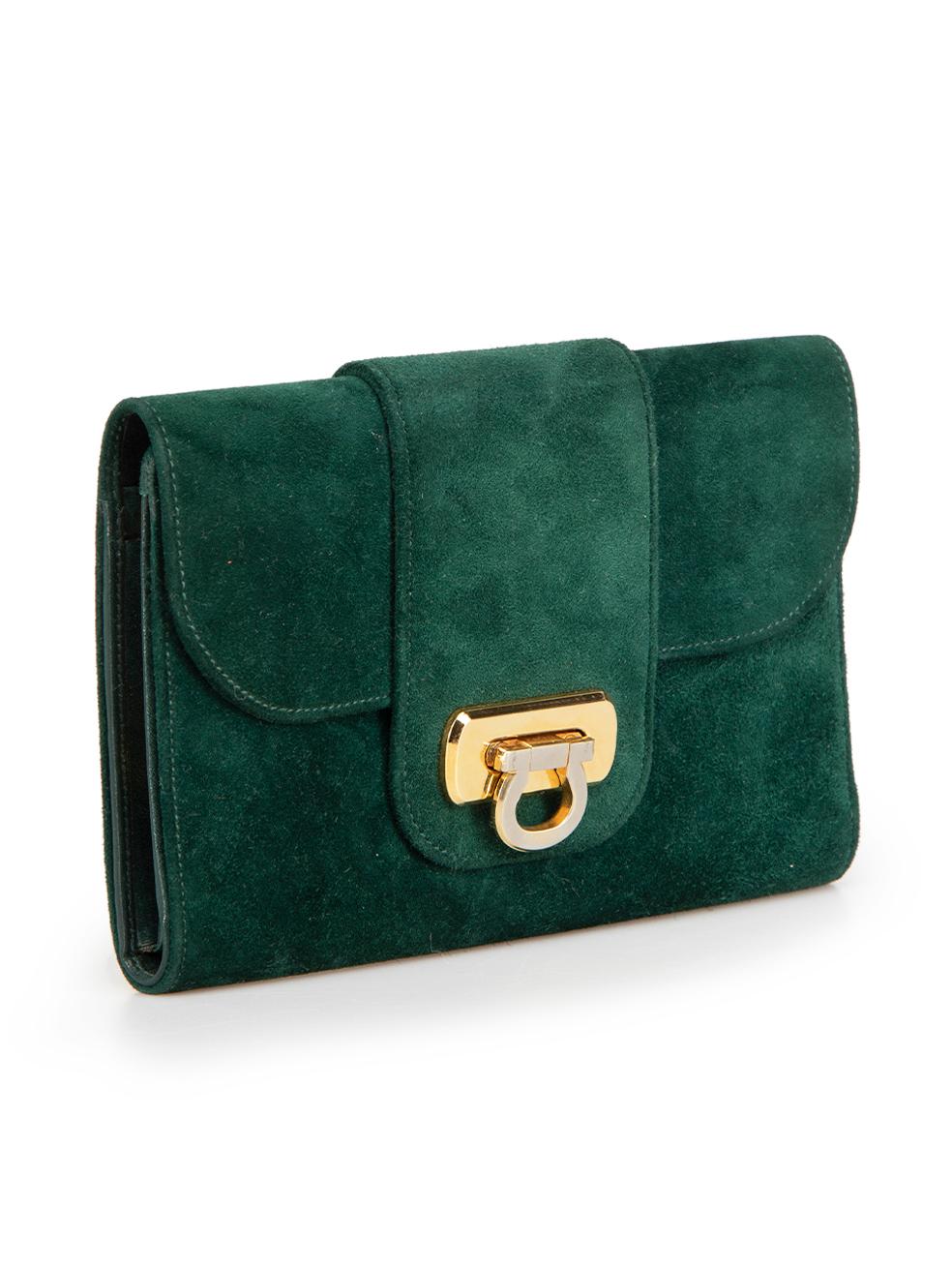 CONDITION is Very good. Minor tarnishing and scratching along exterior hardware. Minimal wear to this Salvatore Ferragamo designer resale item.



Details


Dark green

Suede

Wallet

Front flap clasp closure

4x Internal slip pockets

1x Coin