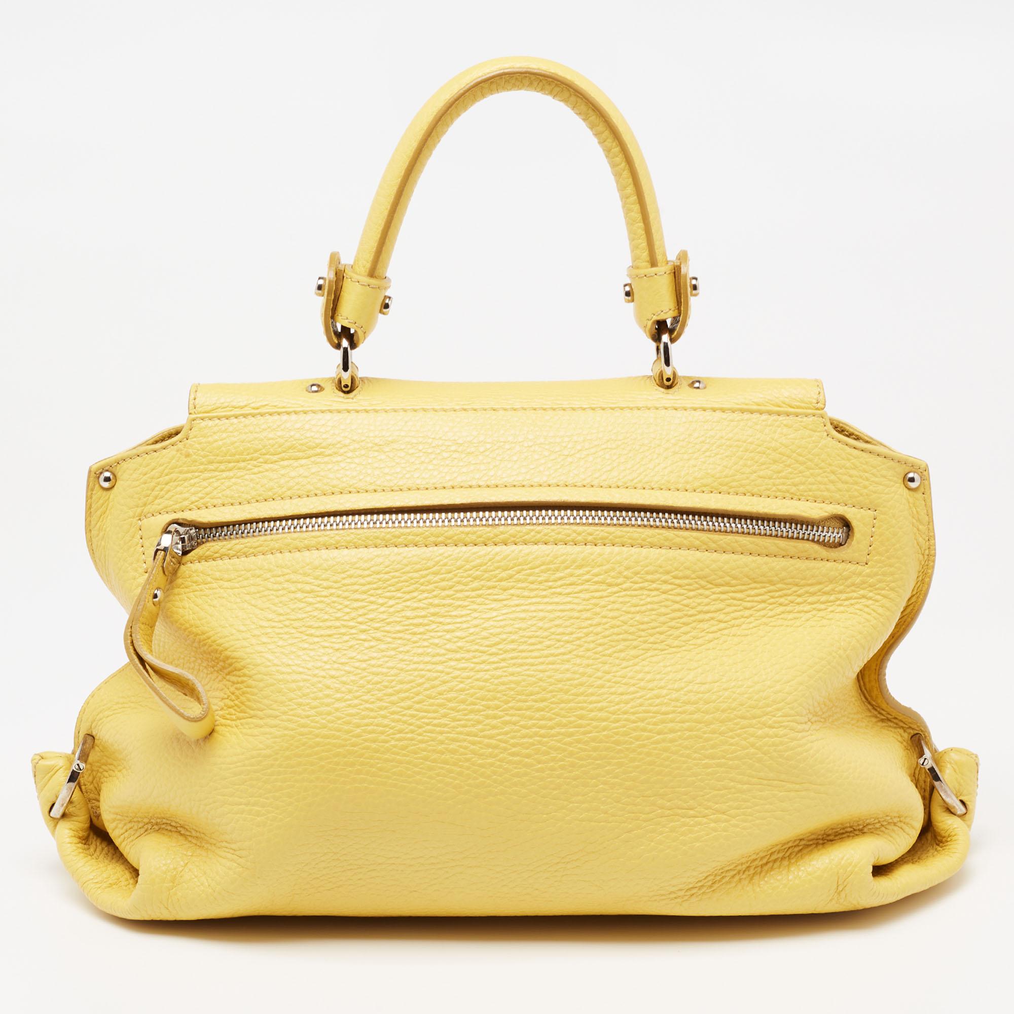 The Sofia is from the Salvatore Ferragamo's Summer/Spring 2009 collection, named after Italian actress Sophia Loren. Infused with signature details, this bag has an incredible combination of contemporary shape and timeless essence. The foldover at