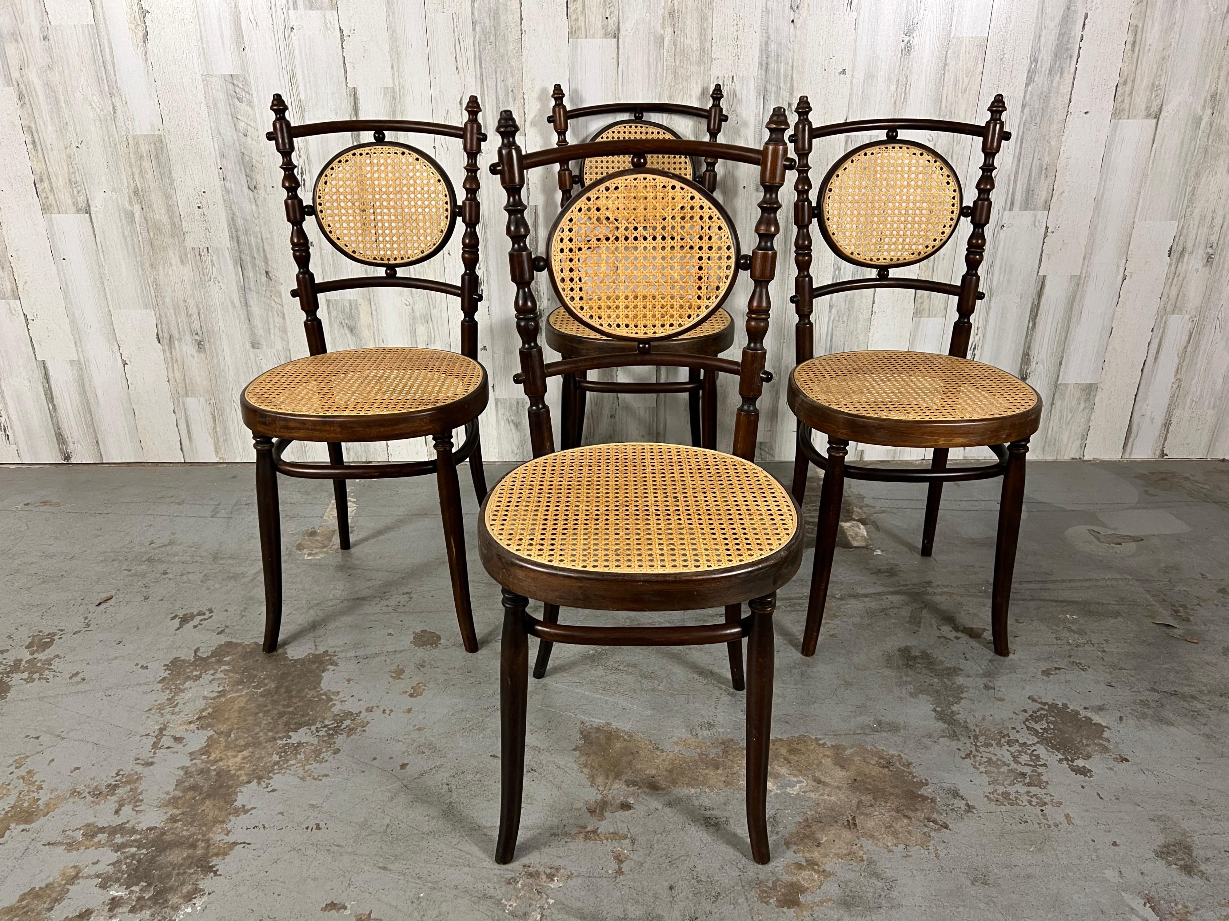 Beautiful set of four bentwood dining chairs by Italian designer Salvatore Leone. Two tone staining on the wood adds a rustic elegance on these very sturdy petit chairs.