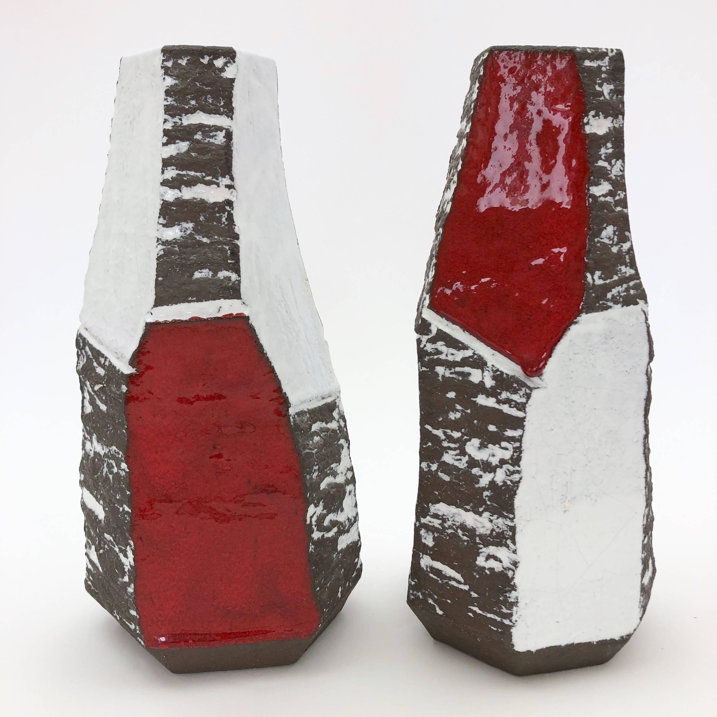 Pair of sculptural lamp bases, geometric shapes, stoneware glazed in glossy white, red, and matte dark brown. 

One-of-a-kind hand-sculpted pieces, signed back with the artist's stamp.

* Height dimension is for the pottery sculpture only, and