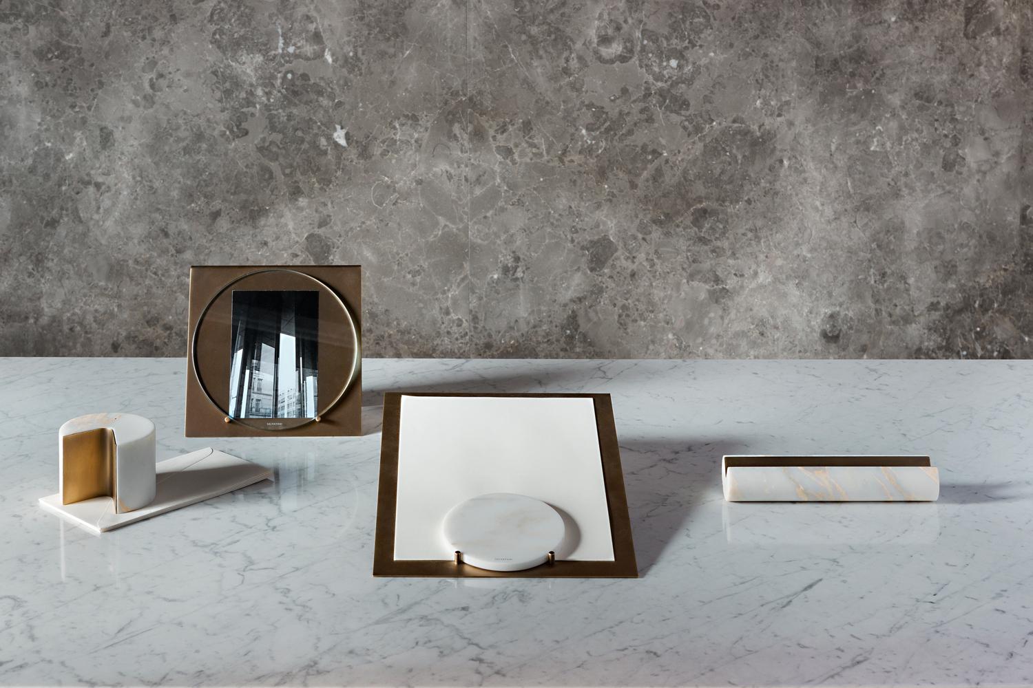 Frame in burnished brass with glass shield. Designed by Studiocharlie for Salvatori, the Balancing series of desktop accessories combines brass and natural stone for a fresh take on traditional decorative objects. Perfect as a desk accessory or