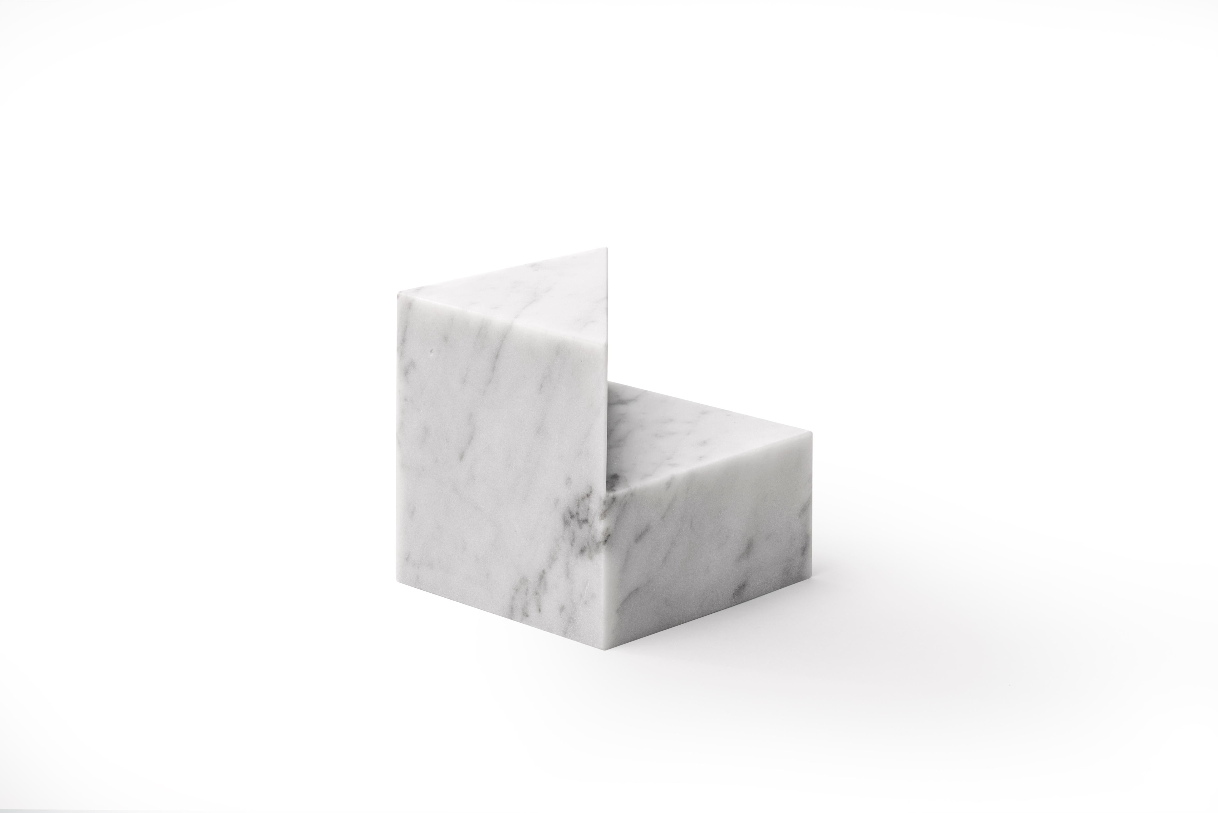A collection of elegant paperweights in natural stone designed by Elisa Ossino for Salvatori. These pieces play with the simplicity of geometry in their cylindrical and cubed forms. Available in classic white Bianco Carrara and striking black Nero