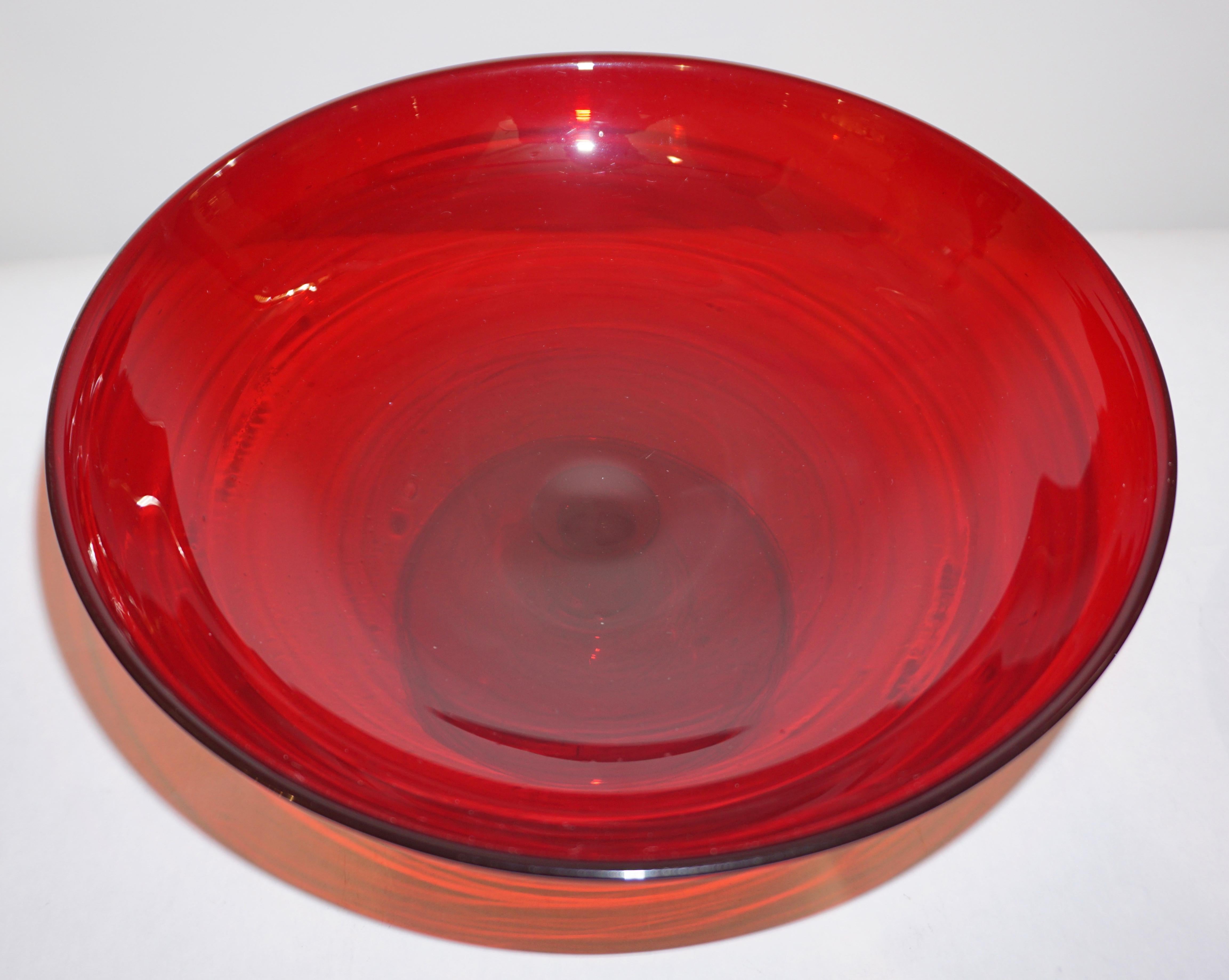 Exquisite Venetian Murano glass tazza centerpiece, in rich deep crimson red, highest quality of execution: delicately blown with rims and raised on footed base. With engraved signature.
Diameter of base: 4.3 inches.
Can be accompanied as a set by