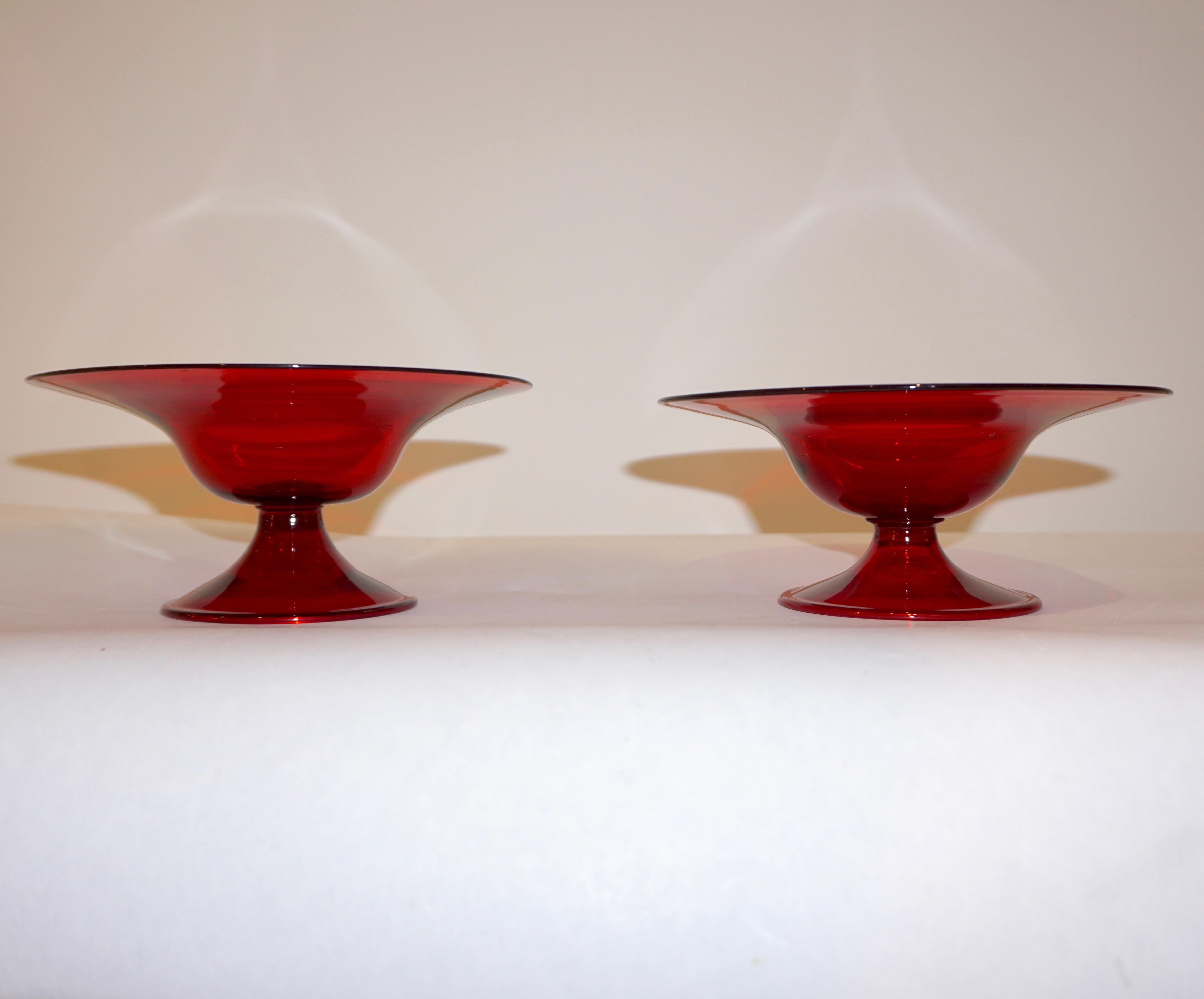 Exquisite Venetian pair of Murano glass tazza dishes, in rich deep crimson red, highest quality of execution: delicately blown with rims and raised on footed base. With engraved signature.
Diameter of base: 3.3 inches.
