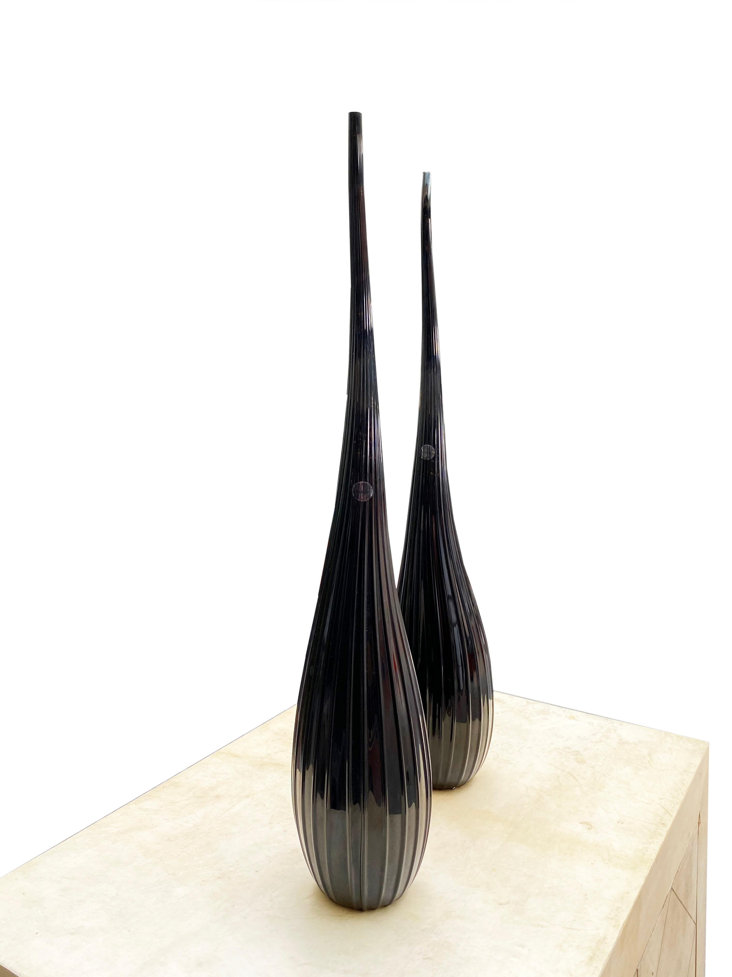 Salviati
By Renzo Stellon
Aria model
2 vases soliflore model aria
In black Murano glass
Piriform in shape with a long, turbulent neck decorated with fine ribs
55 cms high
Signed and dated 2009
Stock items
890 Euros

Salviati.
Glass