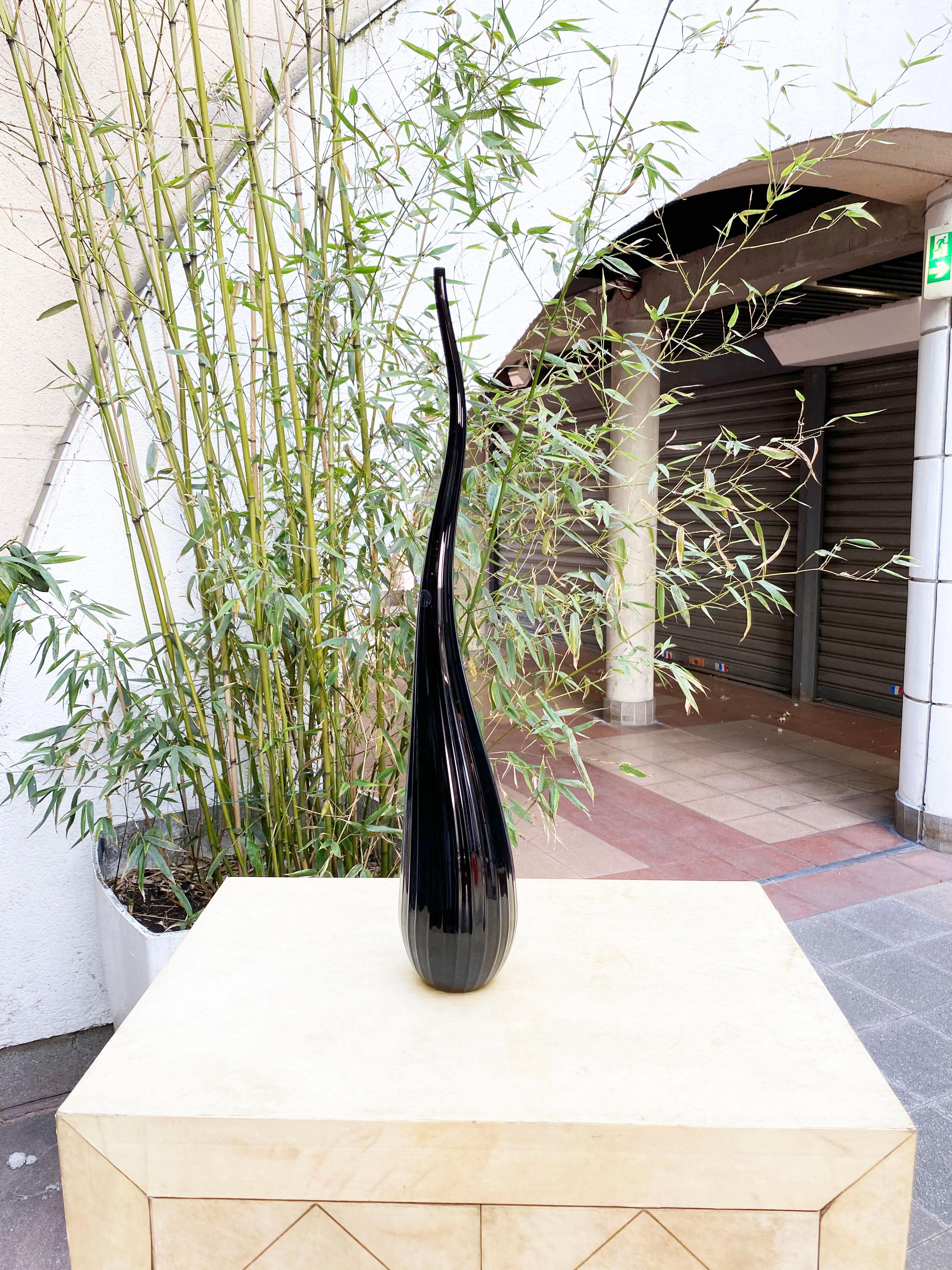 Salviati Murano
by Renzo Stellon
Aria model
1 soliflore vase model Aria
in black Murano glass
piriform in shape with a long, turbulent neck decorated with fine ribs
signed and dated 2009
1 of 55cms high
new in stock with its sticker
490