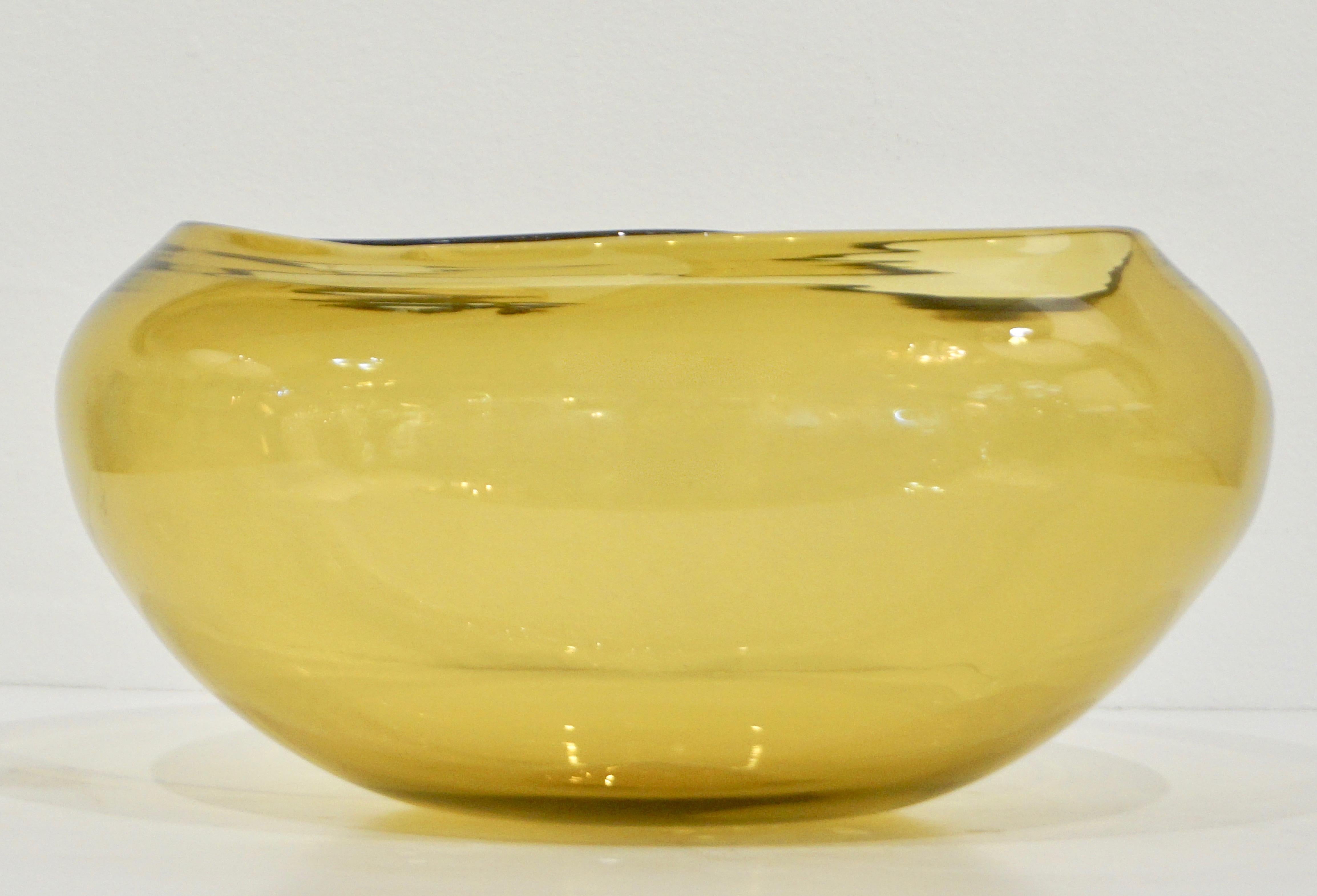 A minimalist yet sophisticated blown Murano glass vessel by Salviati in warm honey amber color, of organic modern design with waved border creating an inspiring abstract shape. Signed piece.

Can be accompanied by similar bowl to make a pair as per