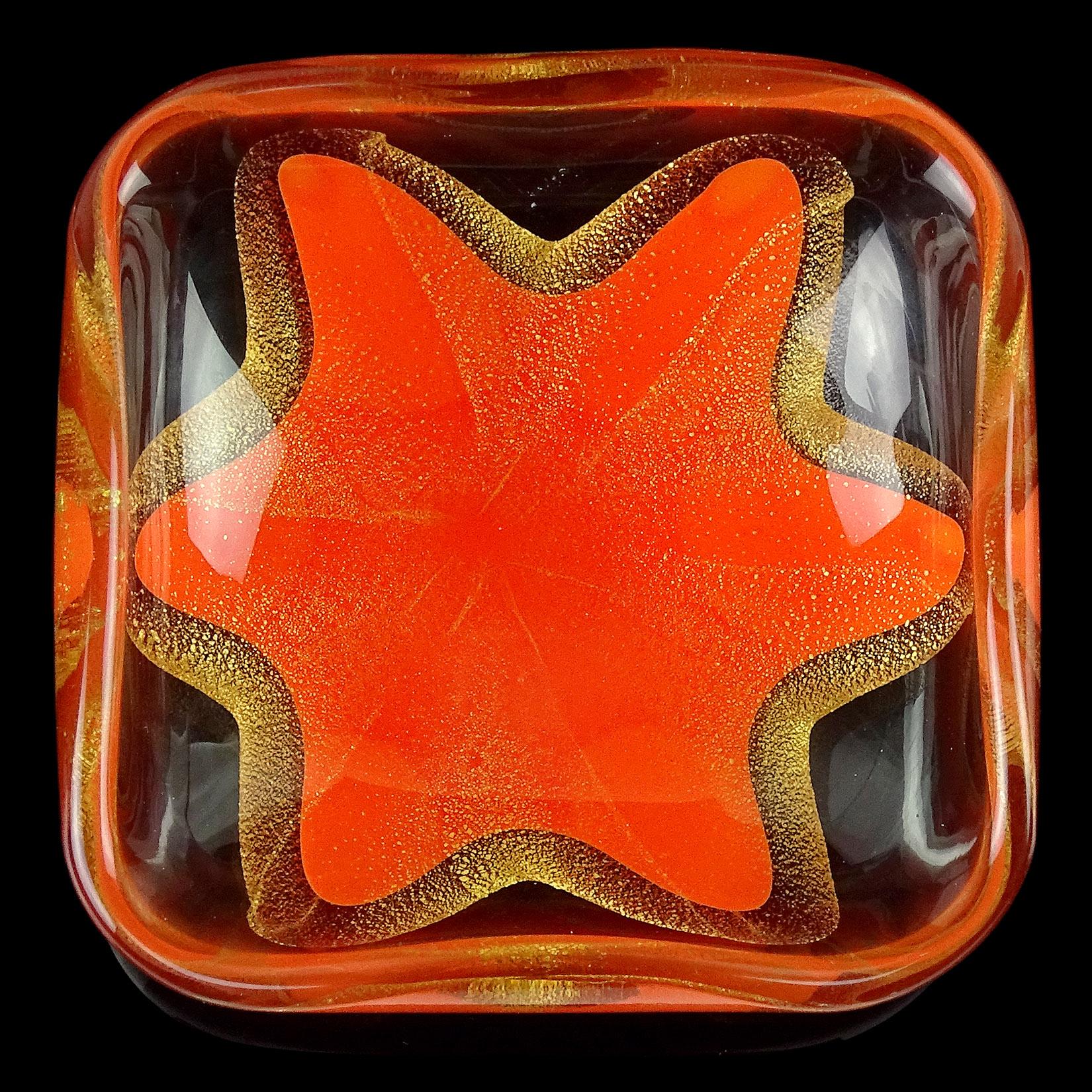 Beautiful set of vintage Murano hand blown orange and gold flecks Italian art glass star design ring or trinket dish set. Documented to the Salviati company, circa 1950s. Although small, they are packed with gold leaf layer surrounding the starfish