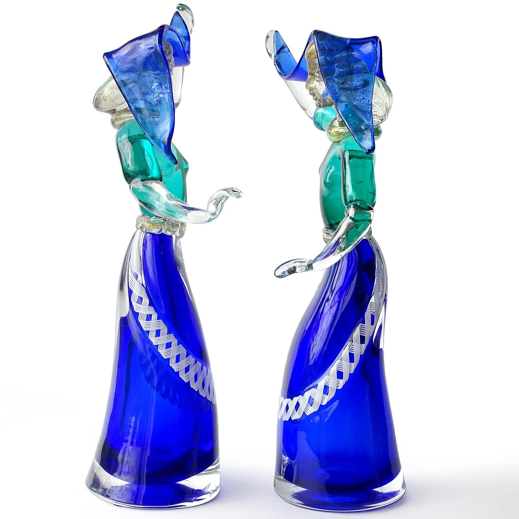 Priced per item (2 available as shown). Beautiful Murano hand blown Sommerso cobalt blue and green Italian art glass dancing women sculptures. Documented to the Salviati company. The figures have a blue skirt with white ribbon decoration. They also