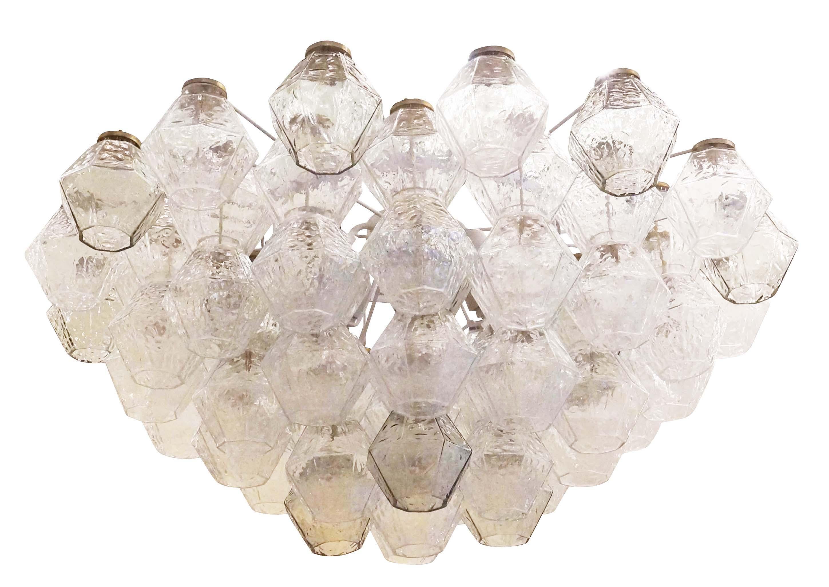 Italian Mid-Century chandelier by Salviati composed of clear and smoked Murano glasses. White frame holding 7 E26 sockets. Matching wall lights also available. 

Condition: Excellent vintage condition, minor wear consistent with age and