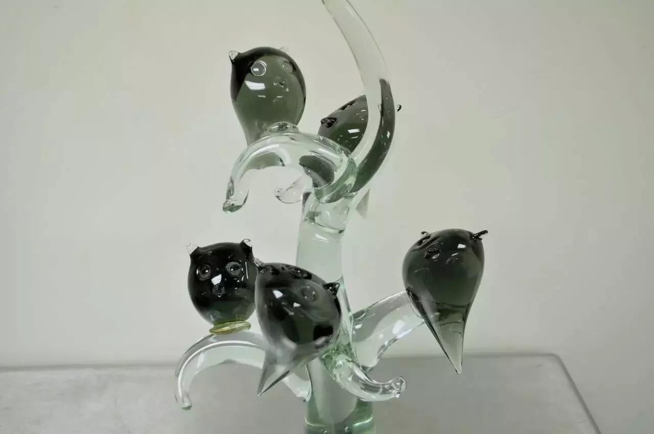 Salviati Murano Italian Modernist Perched Owl on Tree Art Glass Sculpture. Item features a blown art glass sculpture of four perched owls on a tree attributed to Murano for the Salviati Company (unsigned). Circa Mid 20th Century. Measurements: 24