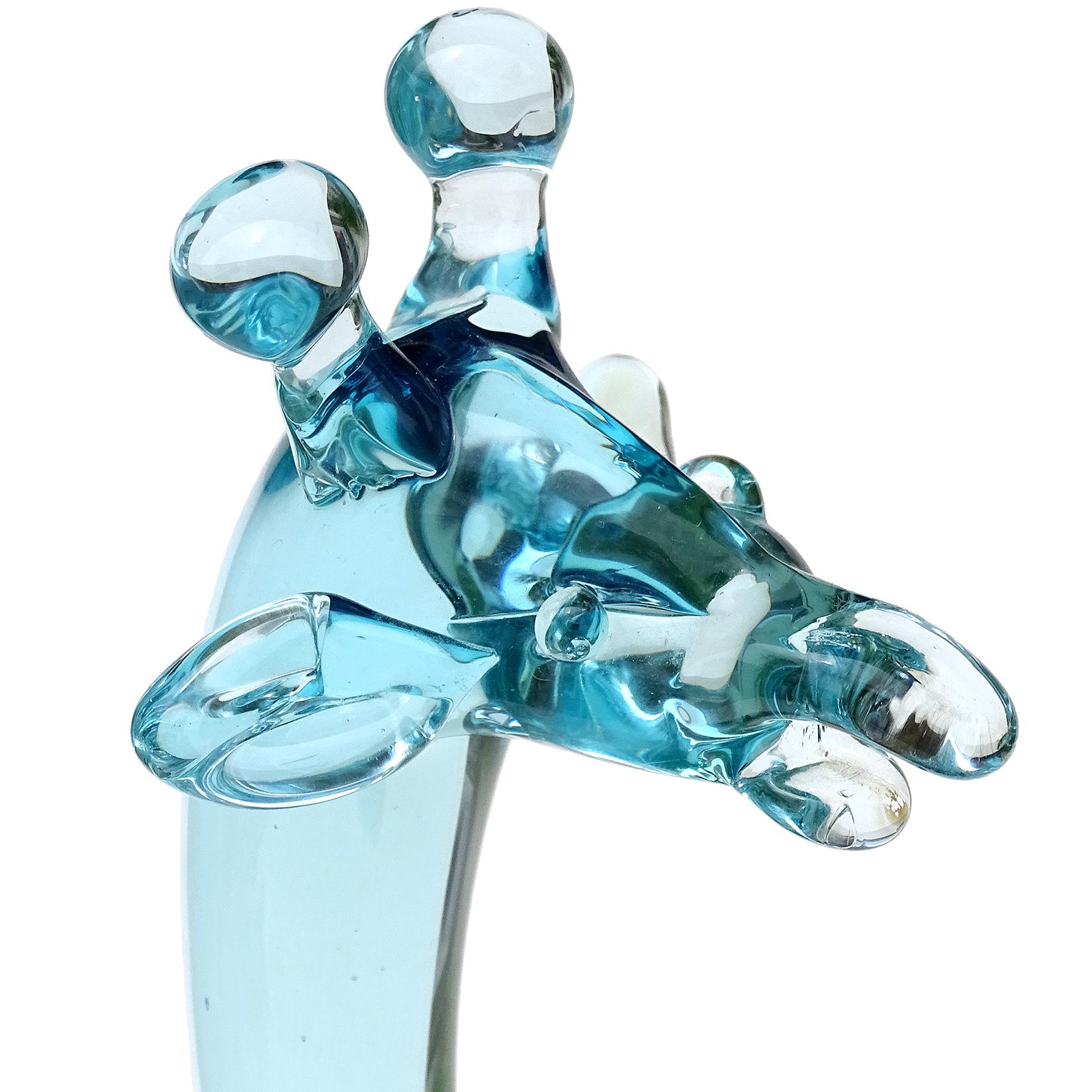 Beautiful, large vintage Murano hand blown Sommerso light blue and cobalt blue Italian art glass giraffe sculpture. Documented to the Salviati company, circa 1960s. The piece has a well detailed head, with a minimal body. The giraffe is also made