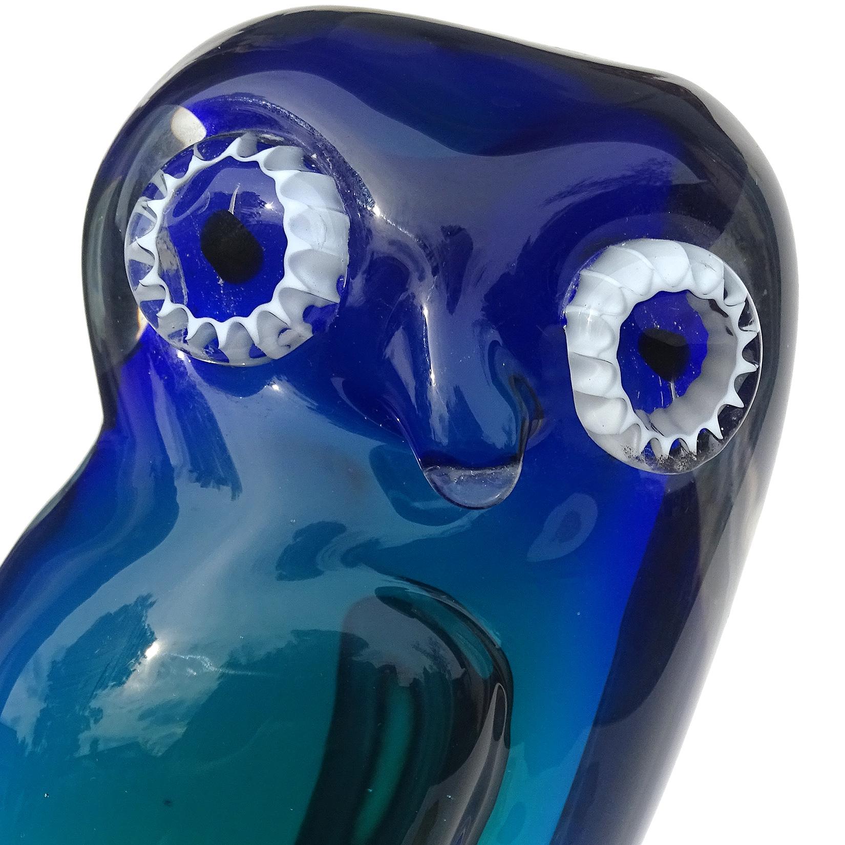 Beautiful vintage Murano hand blown Sommerso cobalt blue to teal blue Italian art glass owl sculpture. Documented to the Salviati Company. Have owned several with labels. It has white murrines for the eyes and stands on clear glass pedestal.