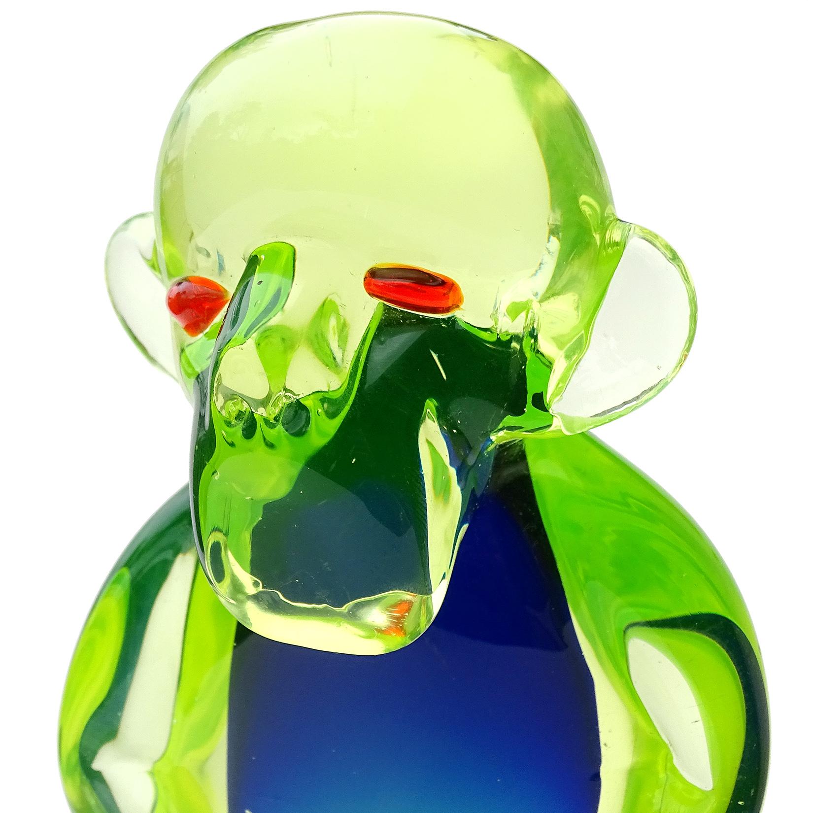 Rare and beautiful, vintage Murano hand blown Sommerso bright yellow green over blue Italian art glass monkey sculpture. Documented to the Salviati Company, with original label still attached underneath. The label reads 
