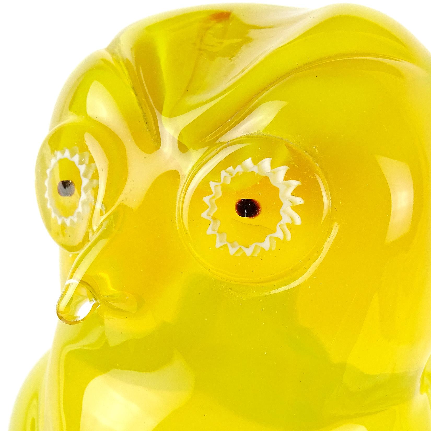 Beautiful Murano handblown Sommerso sunny yellow Italian art glass owl sculpture. Documented to the Salviati Company. It has white murrines for the eyes and stands on clear glass pedestal. Original Salviati gallery label underneath. Measures: 8 1/4”