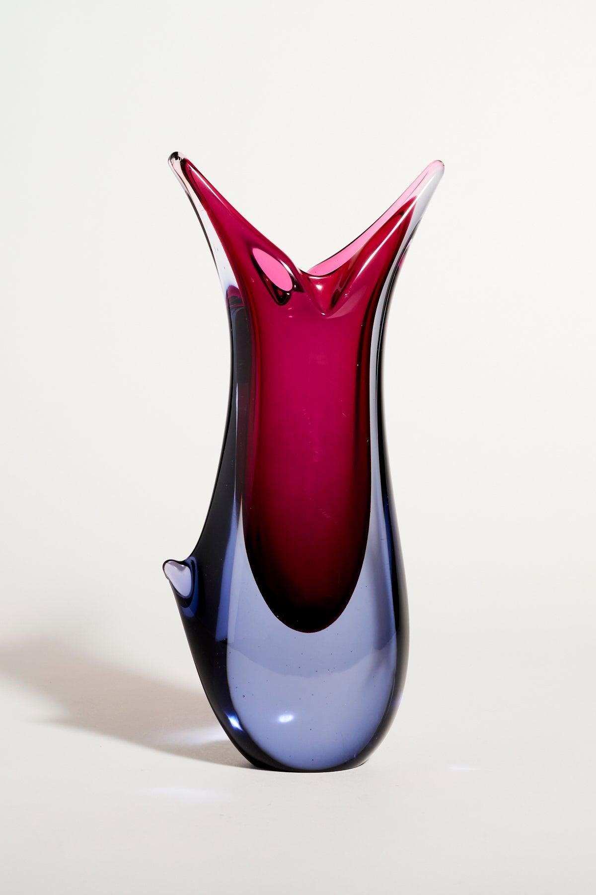 Asymetrical Salviati Murano layered glass vase in shades of rich cranberry contrasted with soft blue gray.