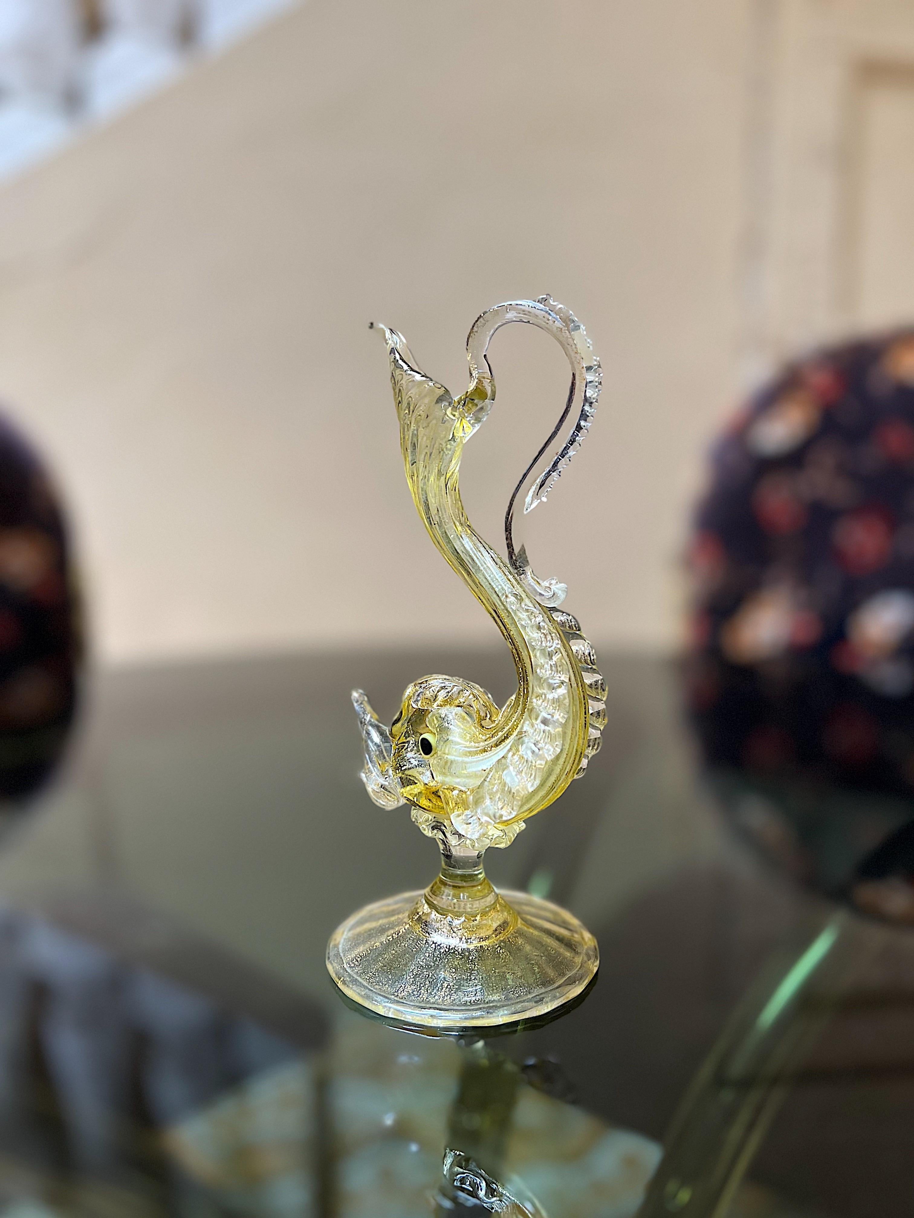 An exceptional example of Venetian glassblowing mastery, this mini caraffe made by Antonio Salviati is sure to impress! All handblown elements are fused together to create this masterpiece.

The detail and workmanship is outstanding. The dolphin