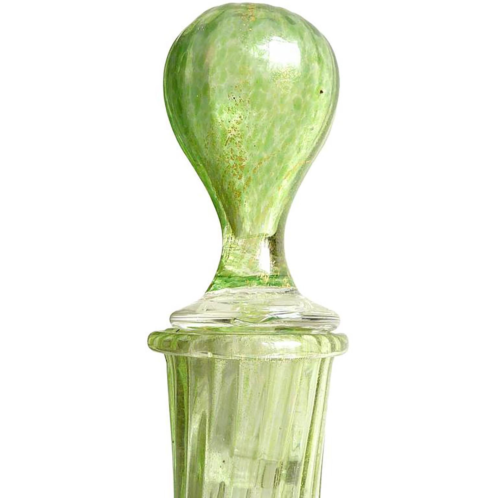 Early antique Venetian hand blown green and gold flecks Italian art glass decanter. Attributed to the Salviati company, circa 1880-1900. The body of the bottle is ribbed, with applied foot, and original stopper. The color is made of tiny little