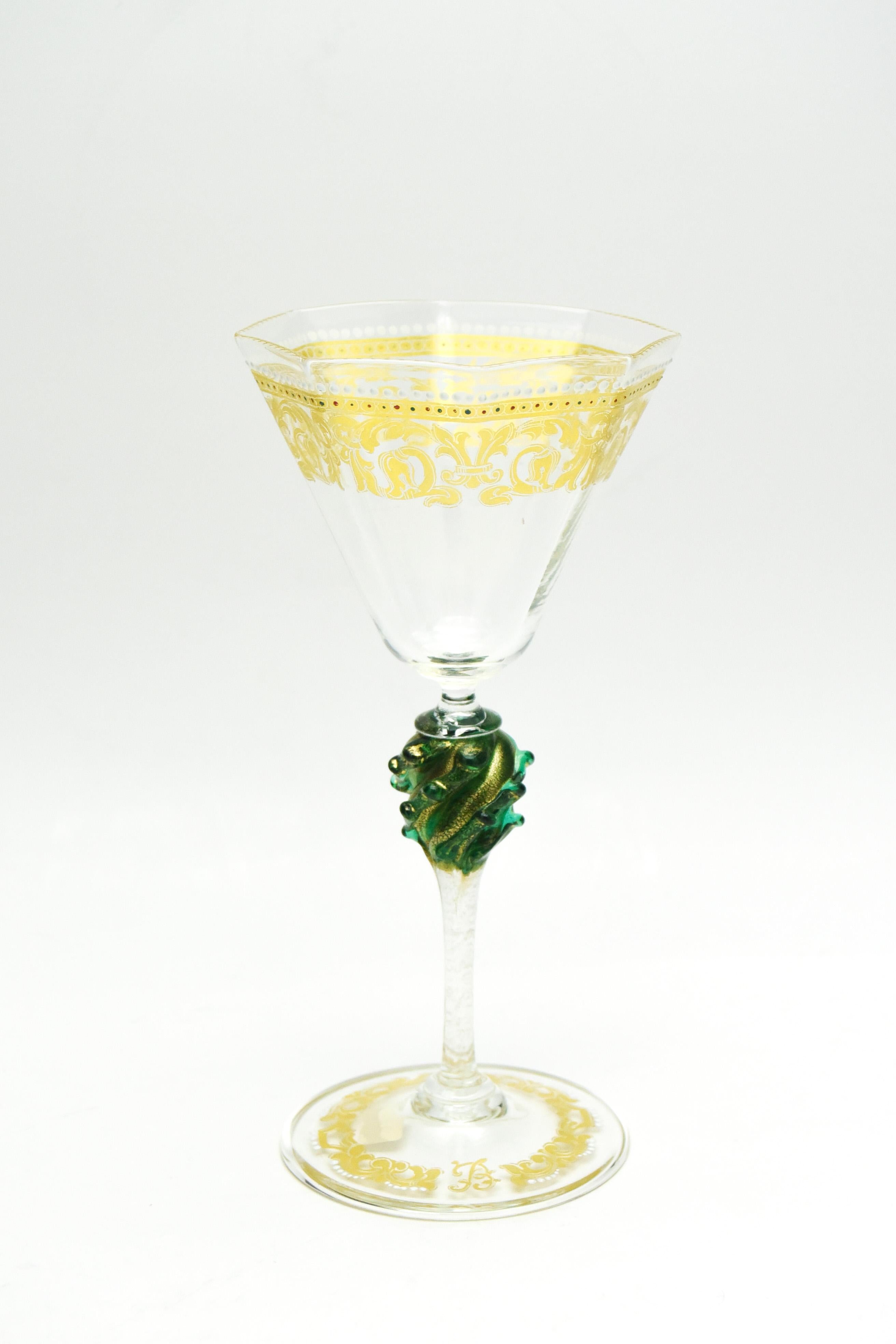 This tall and elegant large and extensive set of hand blown Venetian stemware is decorated with gold and polychrome enamel 