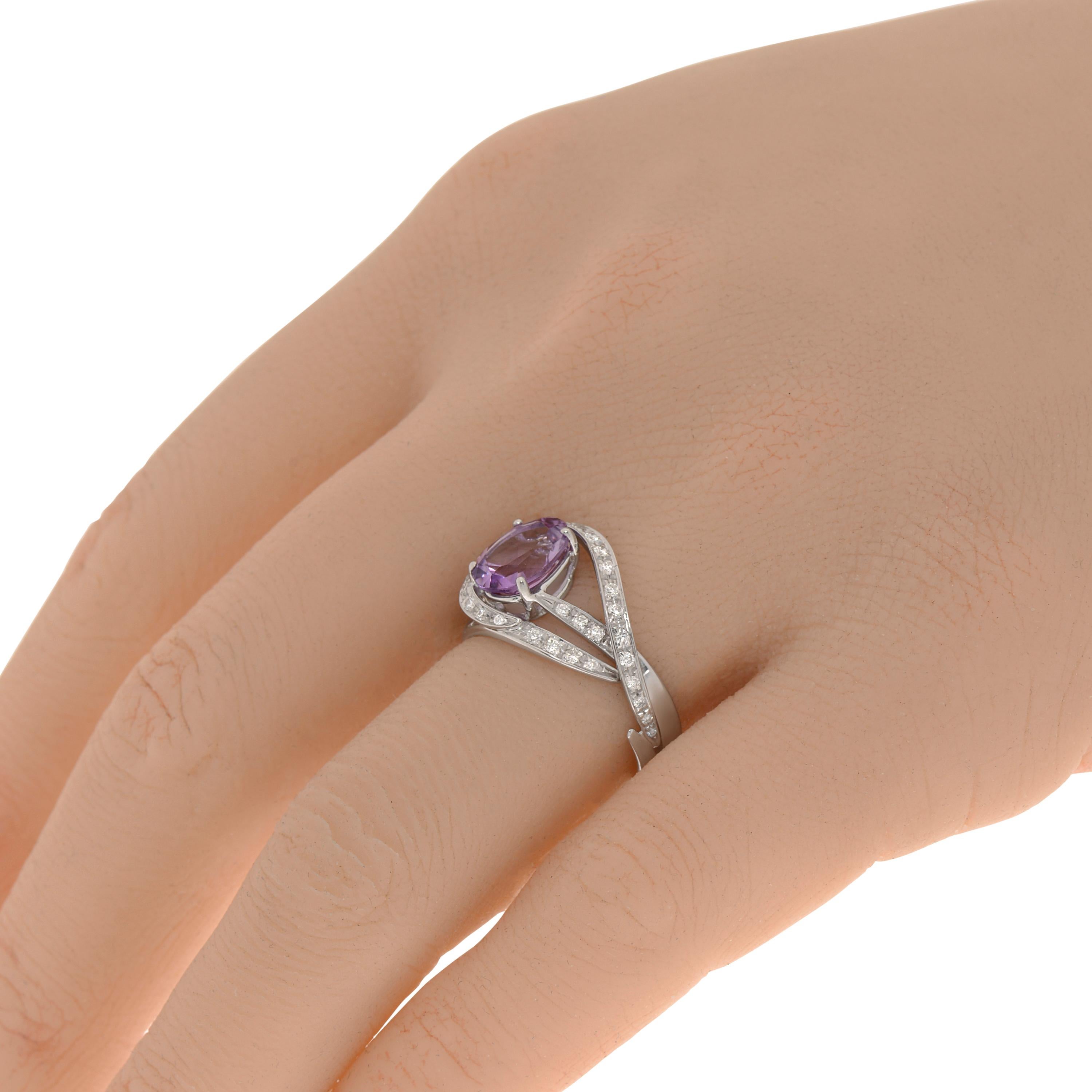 This dazzling Salvini 18K white gold crossover ring features glistening 0.32ct. tw. illusion set diamonds illuminating a dreamy prong set amethyst. Diamond clarity: VS/SI. Diamond color: G-H. The ring size is 6.5 (53.1). The decoration size is 7mm x