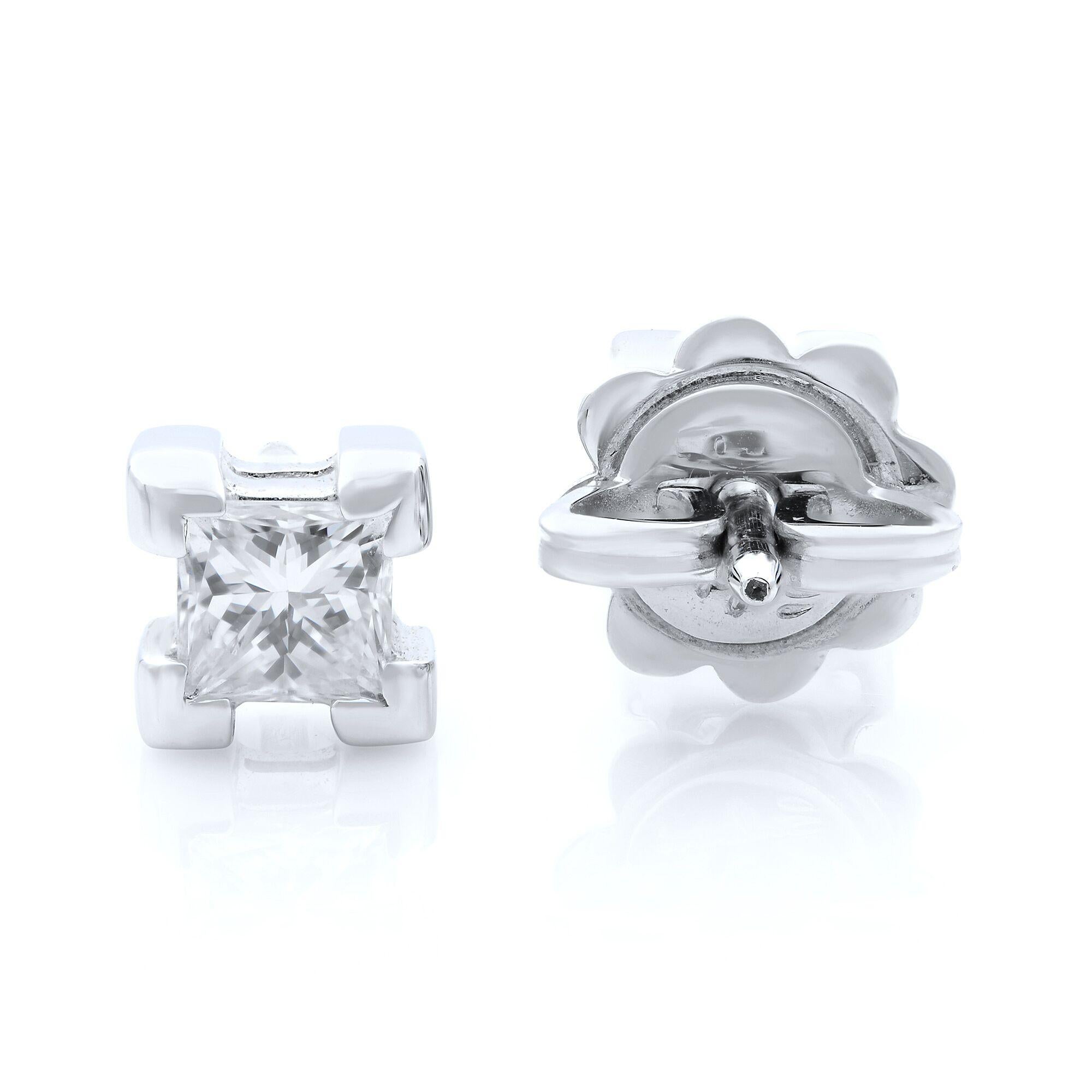 These modern princess cut diamond stud earrings are held in a 18K white gold four-prong setting. Each stone is approximately G-H color and  SI1 clarity, Excellent cut, total diamond weigh is 0.57cts. Each earring is 5mm.
Condition: Pre-owned like