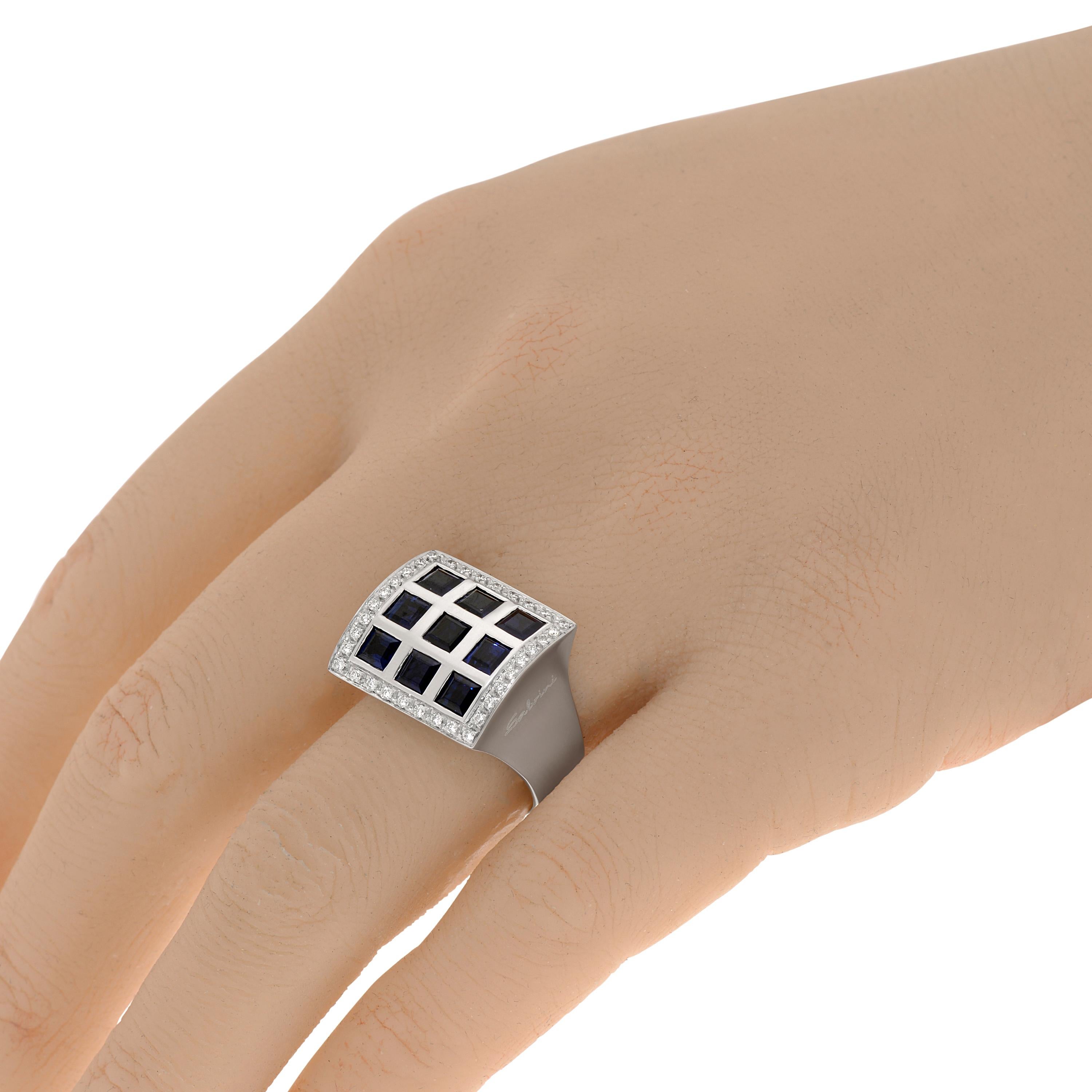 This brilliant Salvini 18K white gold Signet ring features diamonds illuminating a grid of square cut Blue sapphire 2.97ct. tw. Diamond clarity: VS/SI. Diamond color: G-H. The ring size is 7 (54.4). The decoration size is 17.5mm x 16mm. The weight