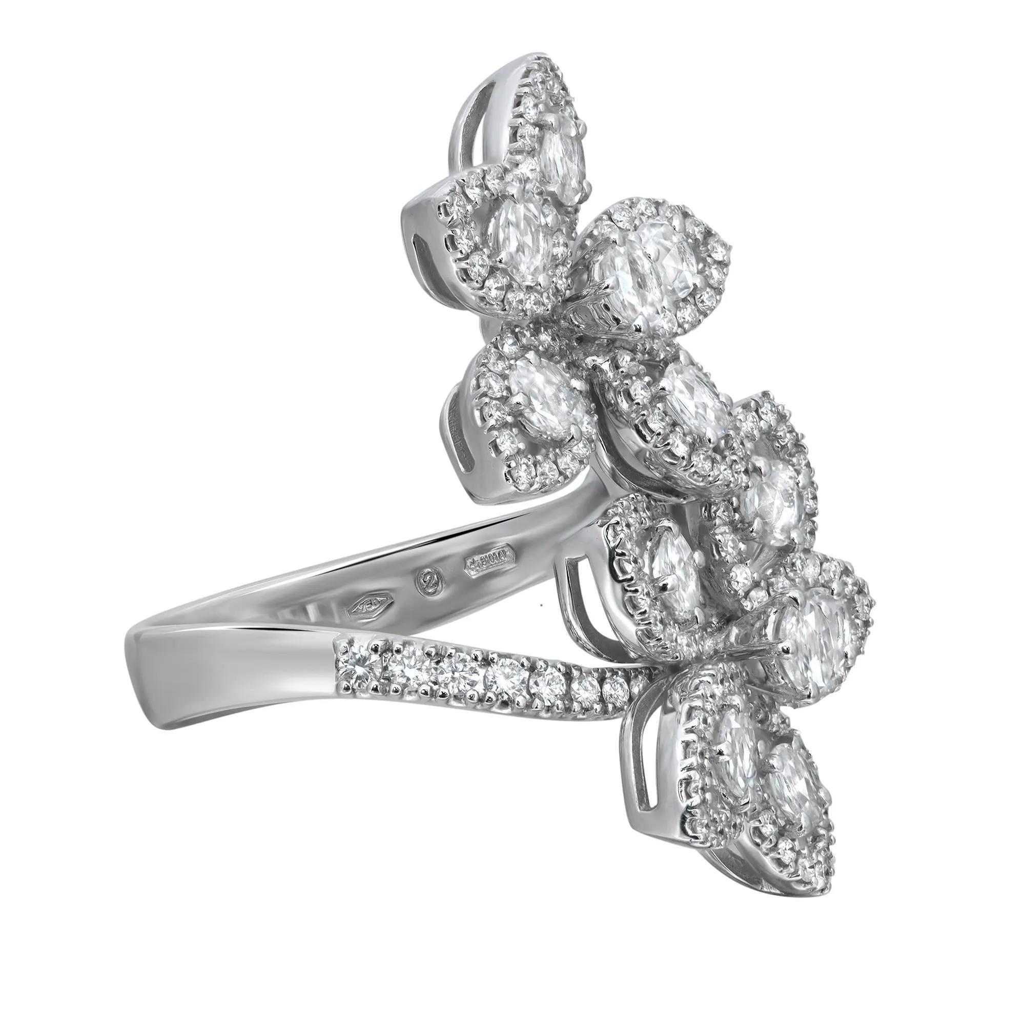 Magnificent diamond floral cocktail ring. Showcasing high brilliance, this ring features two flowers in spiral ring formation studded with center prong set rose cut diamonds outlined with pave set round cut diamonds. Mounted in fine 18k white gold.