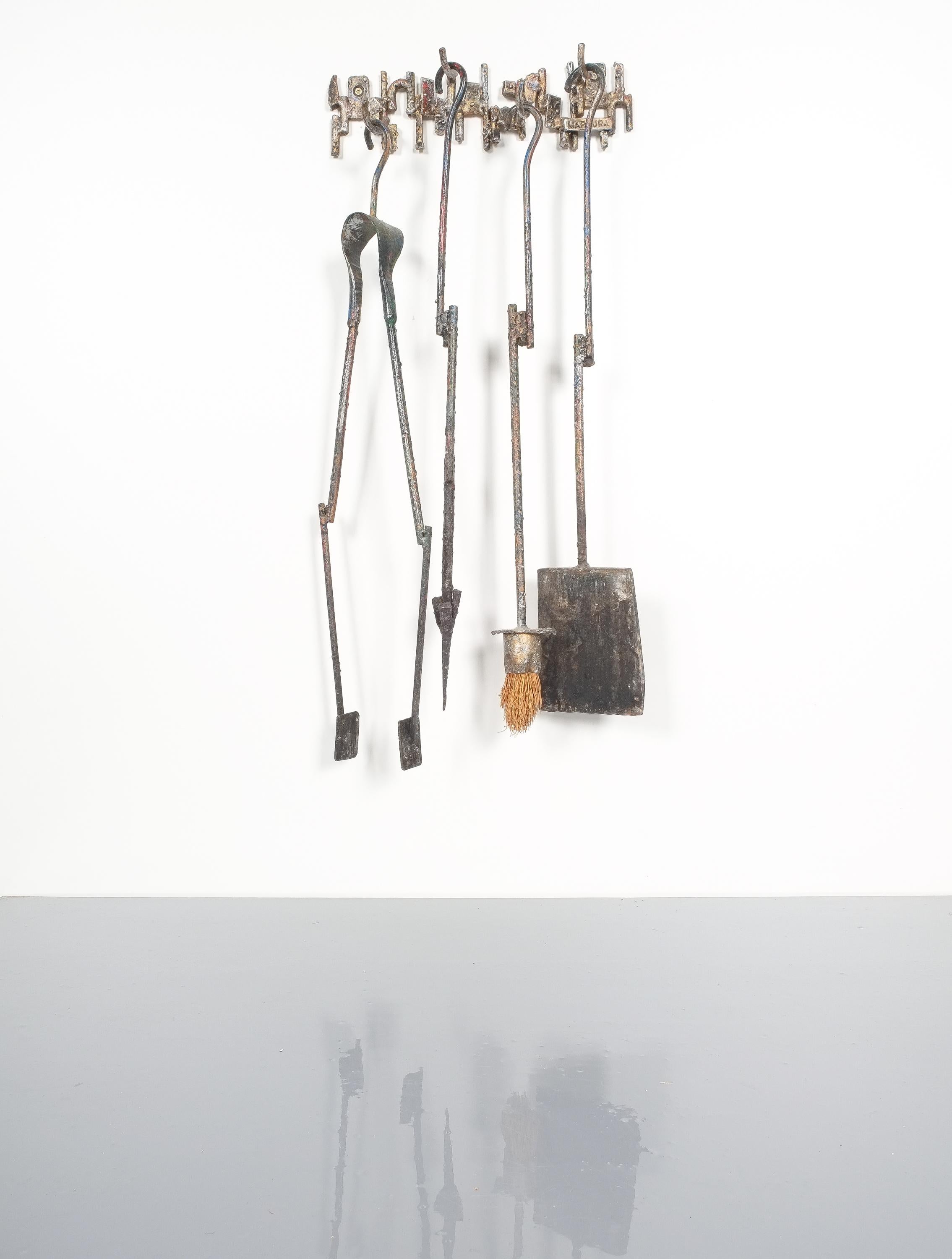 Unique handcrafted set of fire irons by Salvino Marsura, Italy, 1960. Artistic sculptural fireplace tools from welded ornamental iron. It's in original very good condition.