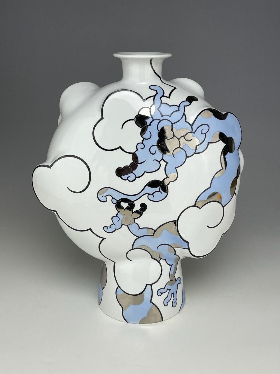 Sam Chung lives and works in Tempe, AZ. He is a ceramic artist and Professor of Art at Arizona State University.  As a second-generation Korean-American, he explores pottery that reframes historical ceramics from a cross-cultural perspective and