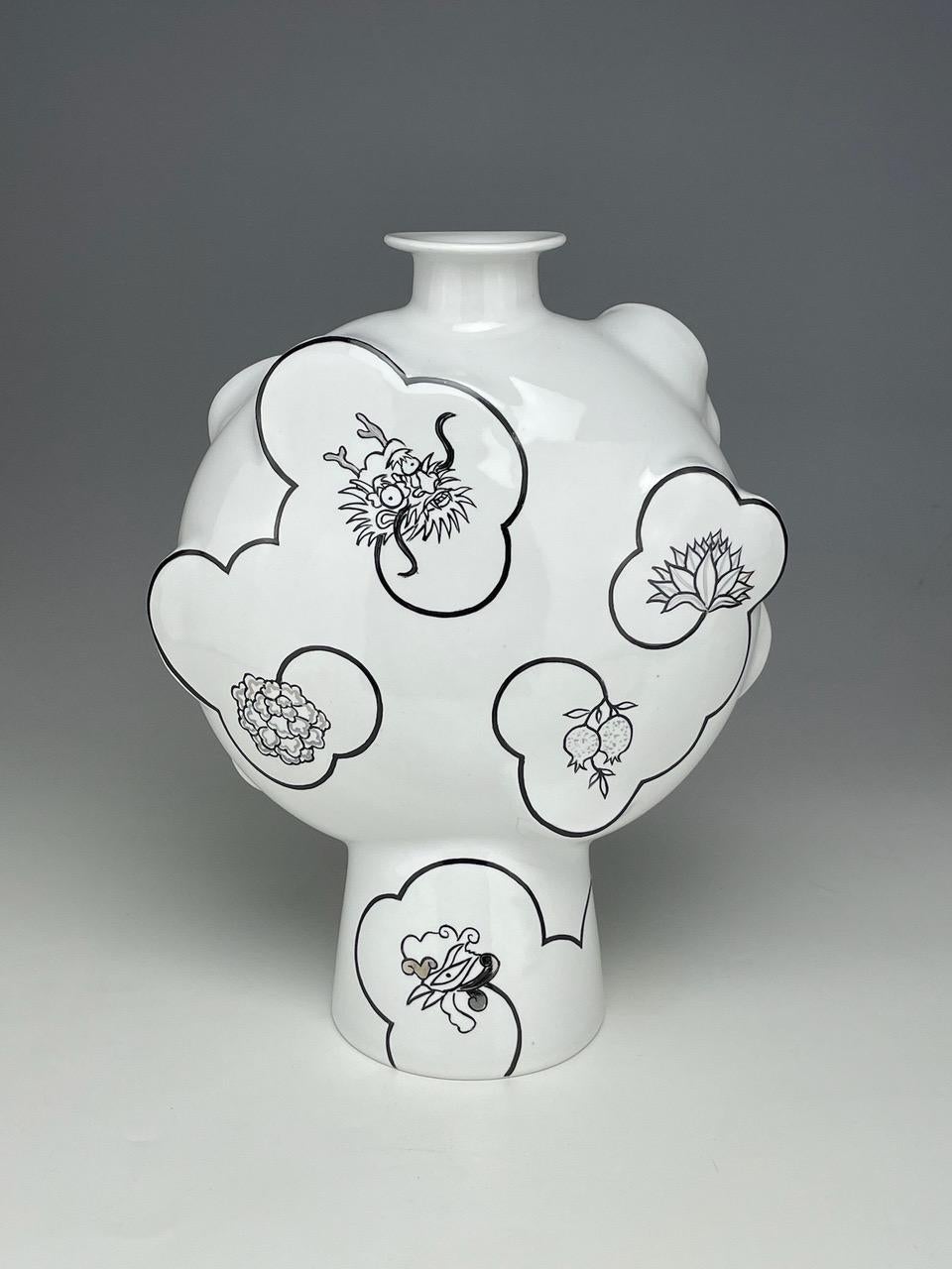 Sam Chung lives and works in Tempe, AZ. He is a ceramic artist and Professor of Art at Arizona State University.  As a second-generation Korean-American, he explores pottery that reframes historical ceramics from a cross-cultural perspective and