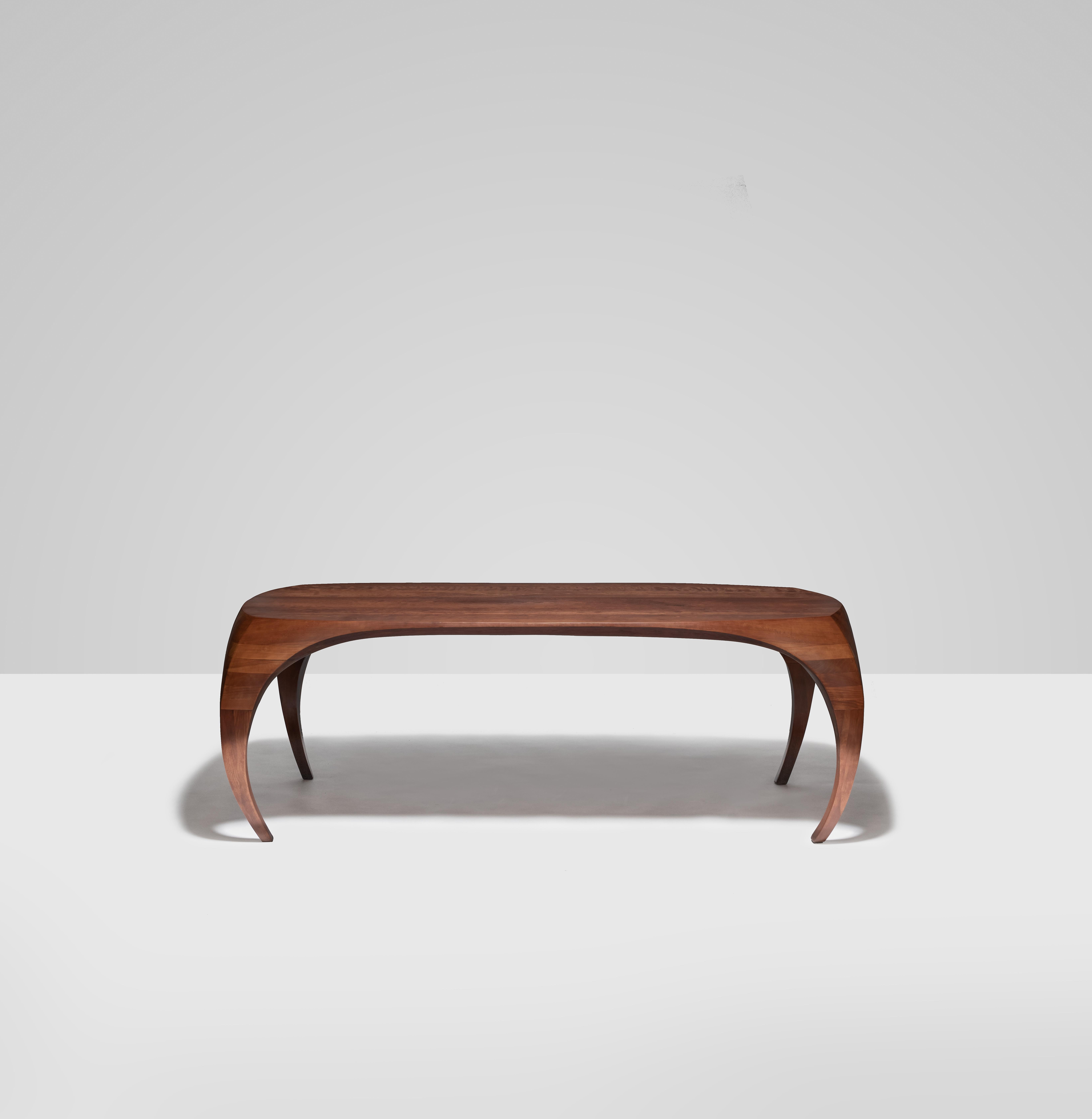 Elegant, rare, and beautifully constructed dining table by Sam Forrest. A lifetime Virginian, Forrest quietly made thoughtful and considered examples of American Studio Furniture for 50 years. This unique 7 ft. dining table is of superior quality