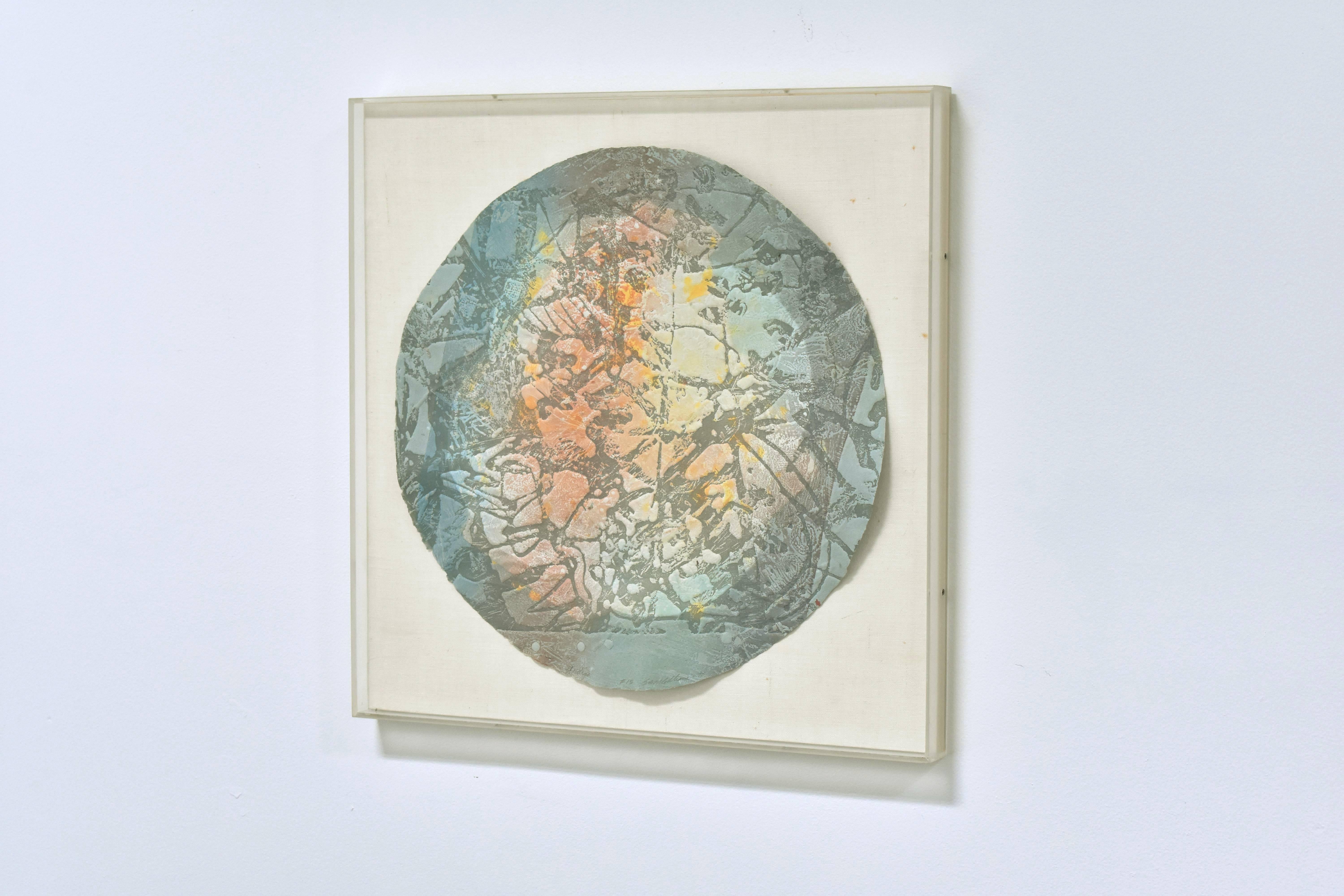 A mixed media artwork by important American artist Sam Gilliam. From an edition of 16 unique works of art, created in 1975. The color palette of red, blue, yellow, orange on a round/disk-shaped piece of handmade paper, mounted in a plexiglass