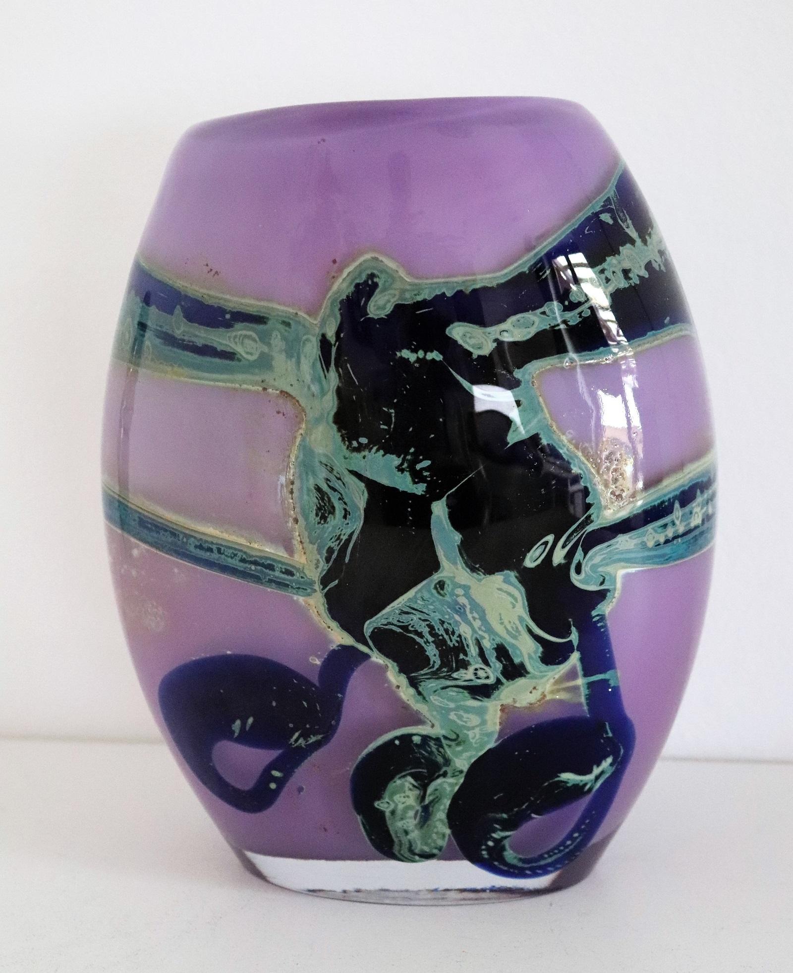 Beautiful art glass vase made by Samuel J. Herman during the early 1970s when he co-operated with Val St. Lambert, Belgium.
Signed from the artist under the vase ( see picture)
The vase is in mint condition and shows stunning shiny colors and a