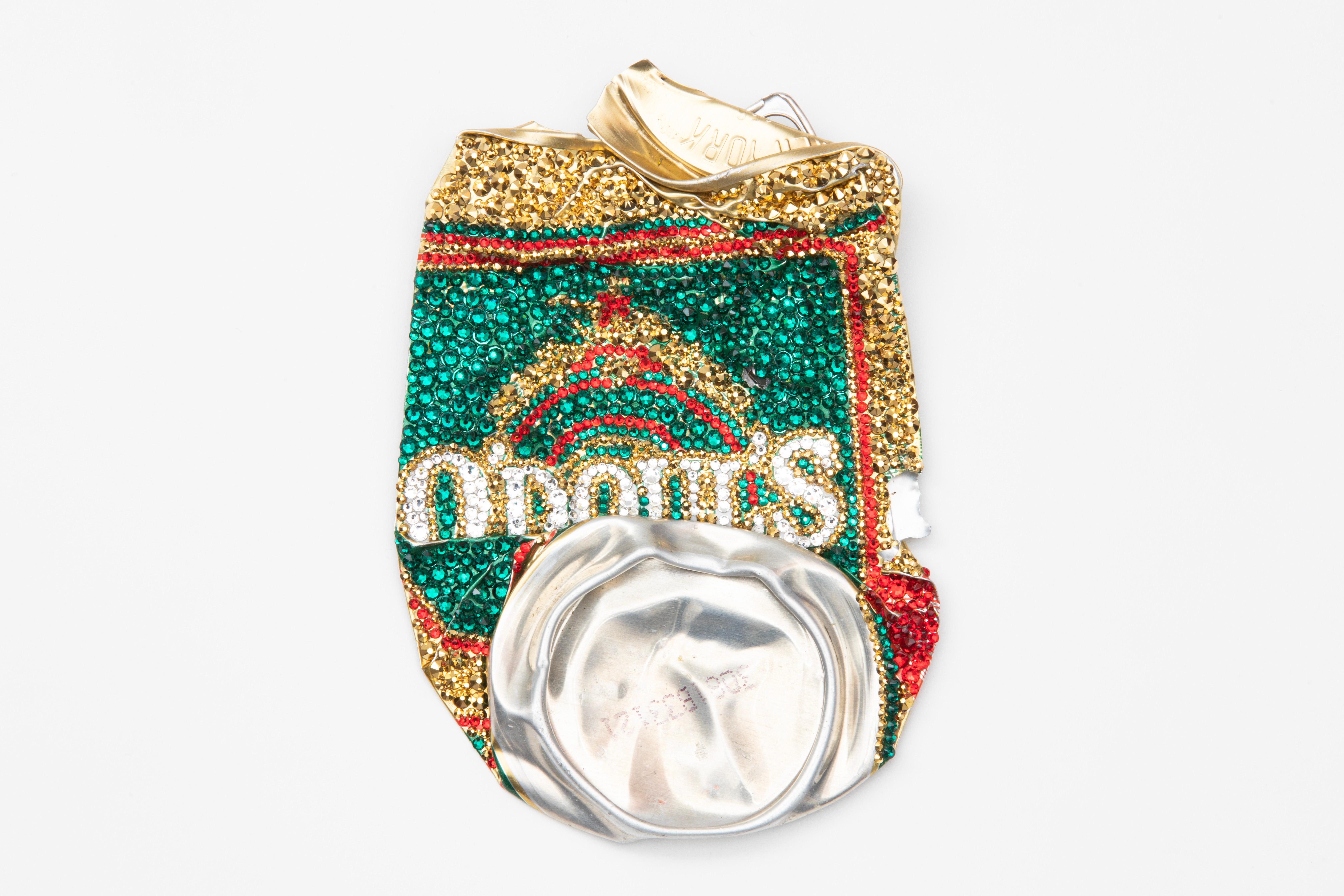 Sculpture made from Swarovski crystals and a found, car-flattened “O’Doul’s” beer can by Los Angeles-based artist Sam Keller. The backside is signed and features a D-ring anchor for hanging. This piece was featured in Sam Keller's 2023 solo