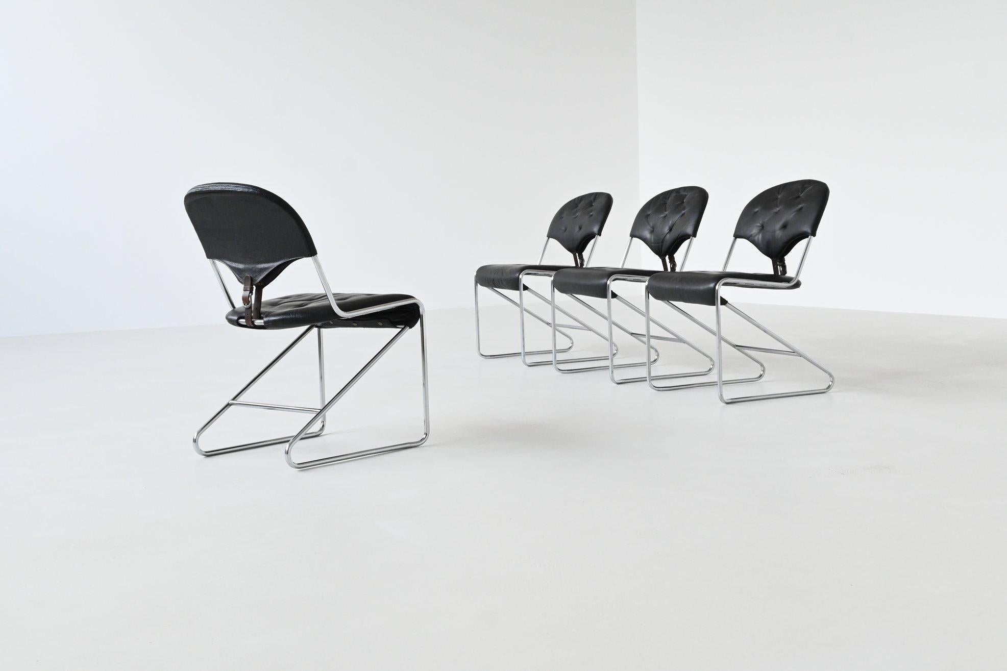 Beautifully shaped set of four dining chairs designed by Sam Larsson for Dux, Sweden 1960. These timeless chairs are upholstered in luxurious black leather, providing both comfort and a sleek, modern aesthetic. The tubular frames are constructed