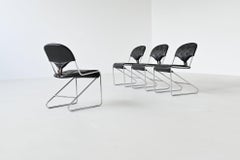 Sam Larsson set of four dining chairs in black leather Dux Sweden 1960