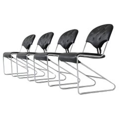 Sam Larsson set of four dining chairs in black leather Dux Sweden 1960