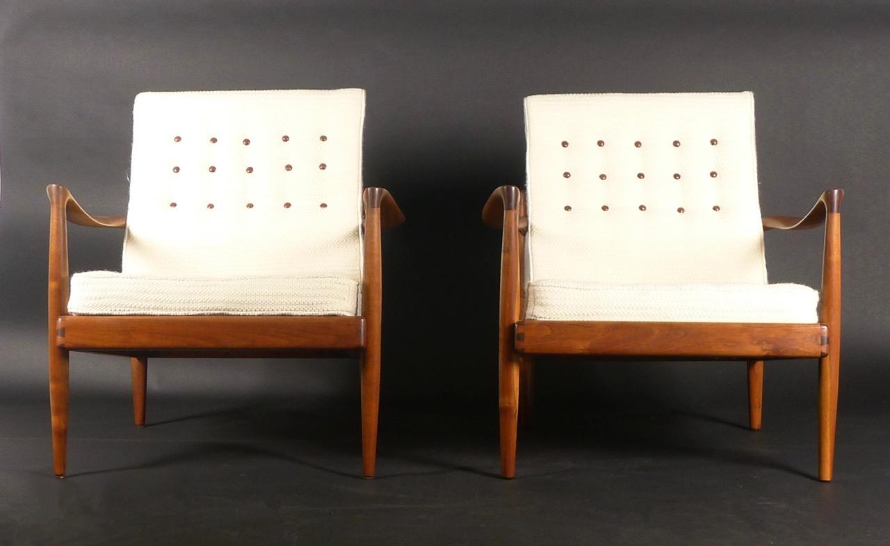 Pair of Hueter lounge chairs by Sam Maloof, circa 1954

American walnut with dovetail joints, the interior of each frame branded designed-made/MALOOF/california

Newly upholstered in Pierre Frey fabric, cream bouclé wool with brown leather buttons. 