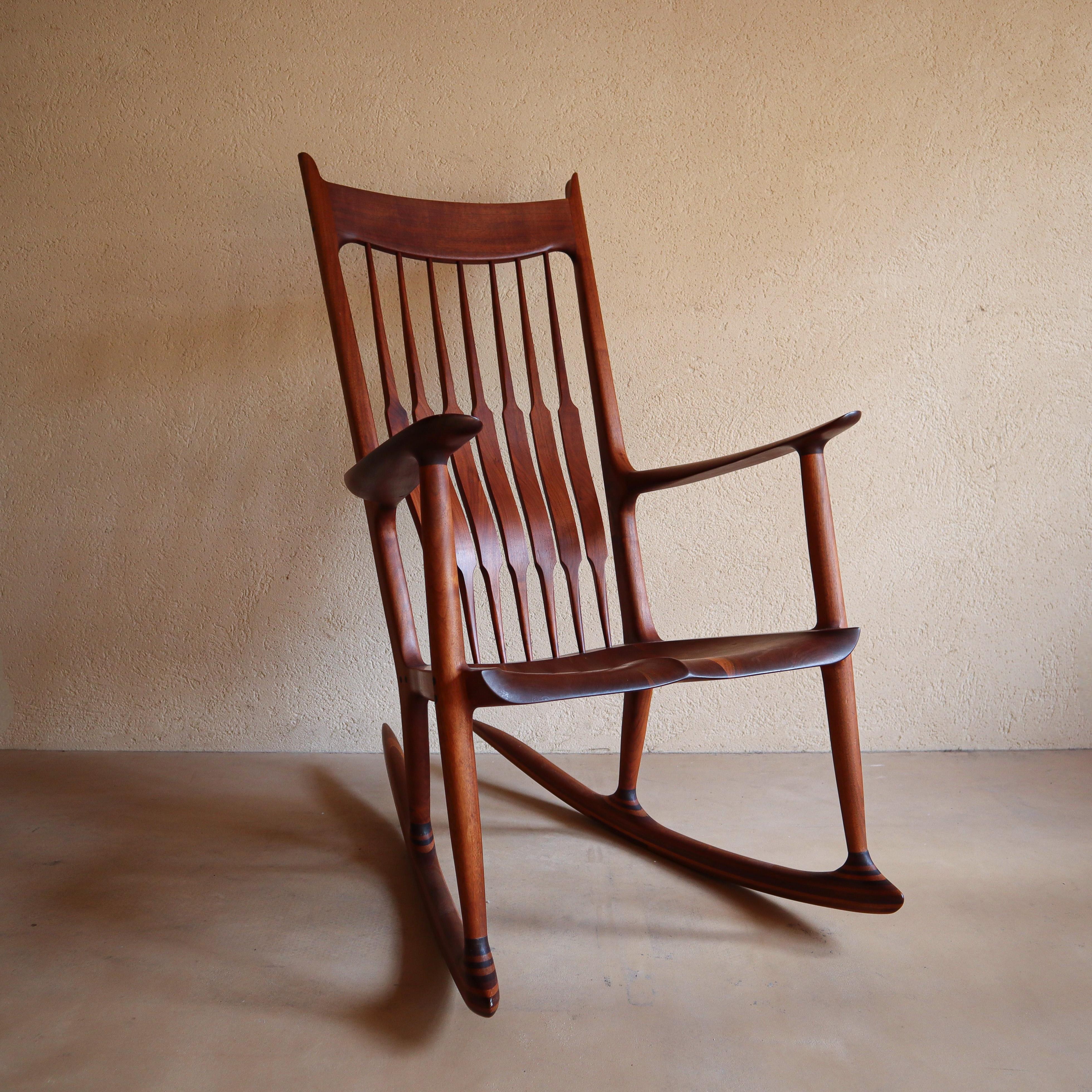 Handcrafted solid wood rocking chair in the manner of Sam Maloof. The level of attention to detail and craftsmanship suggest this was built by an expert craftsman.

Material: Solid Walnut 

Dimensions:

H 1132mm

W 602mm

D