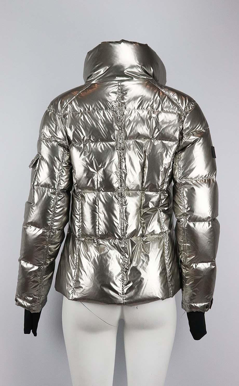 This jacket by SAM. NYC is made from metallic silver shell, this style is filled with insulating goose down, so you're protected from the elements, it's perfect for après-ski but will also look cool worn in the city. Silver nylon. Zip fastening at