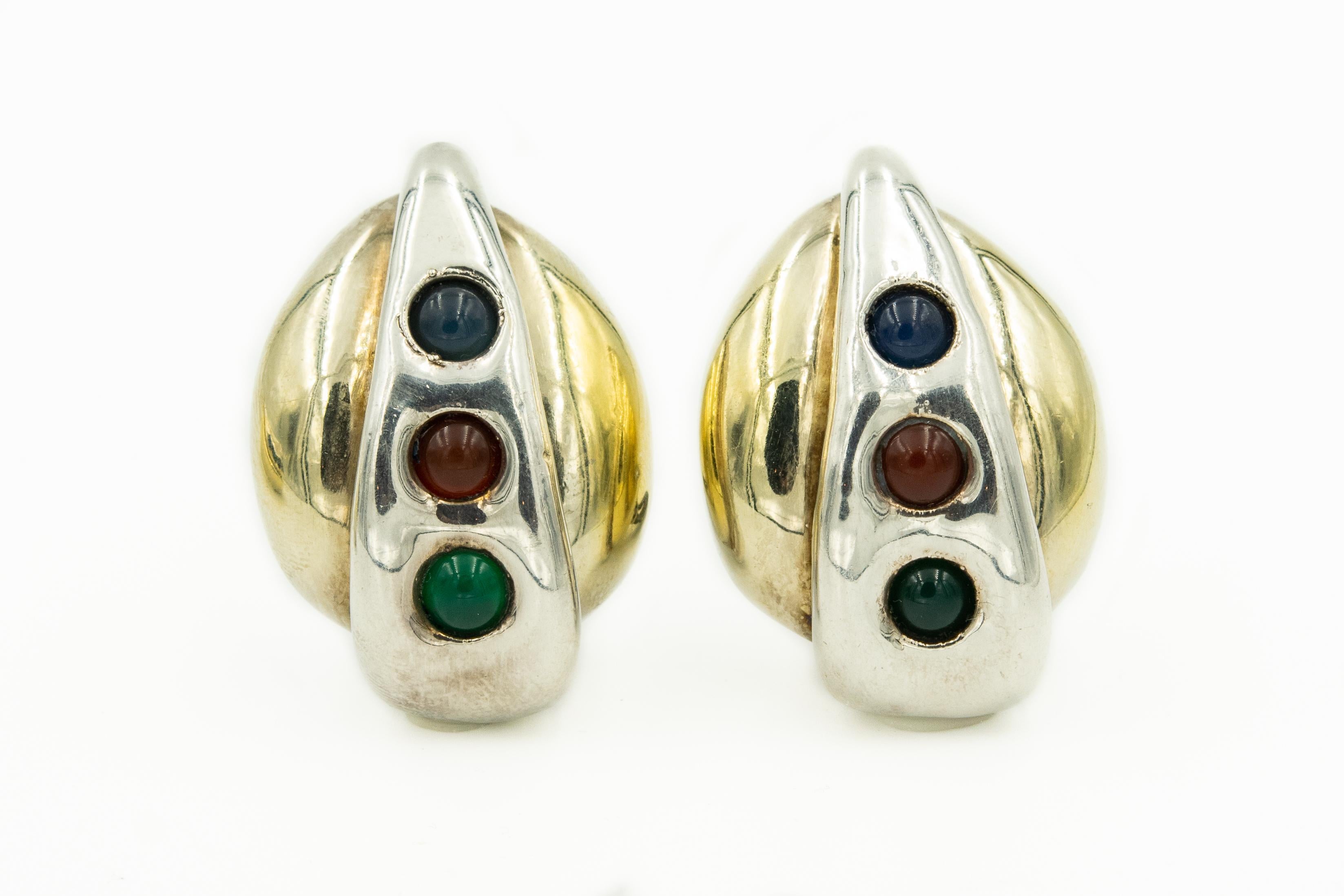 This rare sterling silver set comes from the estate of a Rabbi's wife.  A wonderful combination of sterling silver and gold vermeil to give it a more dimensional look.  It is then accented with cabochon colored stones.  

The bracelet is 3.046