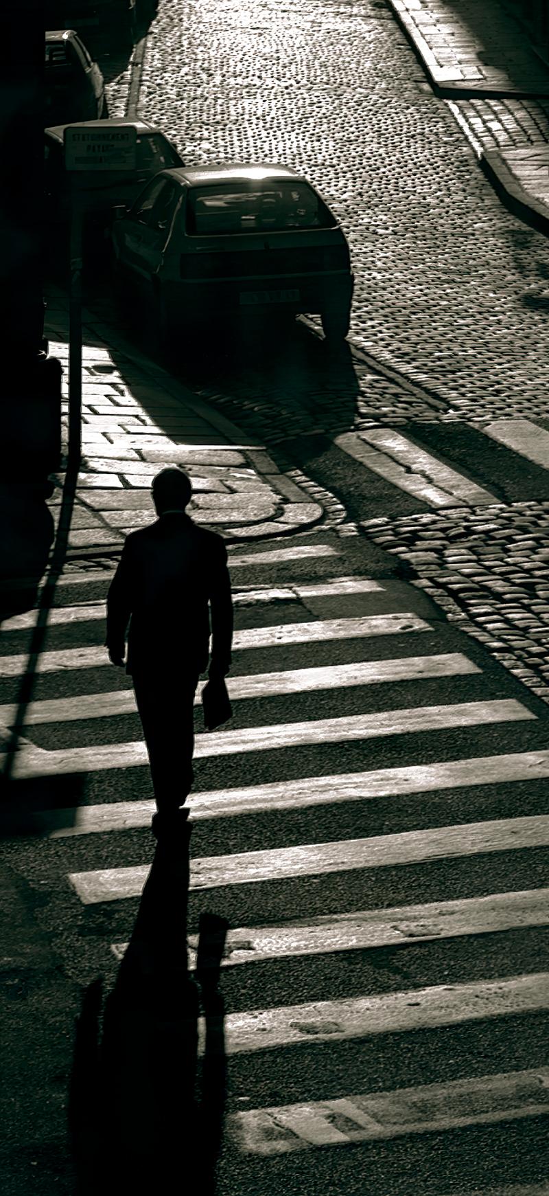 Man walking - Black and white photo, Limited edition fine art print, city - Contemporary Photograph by Sam Thomas