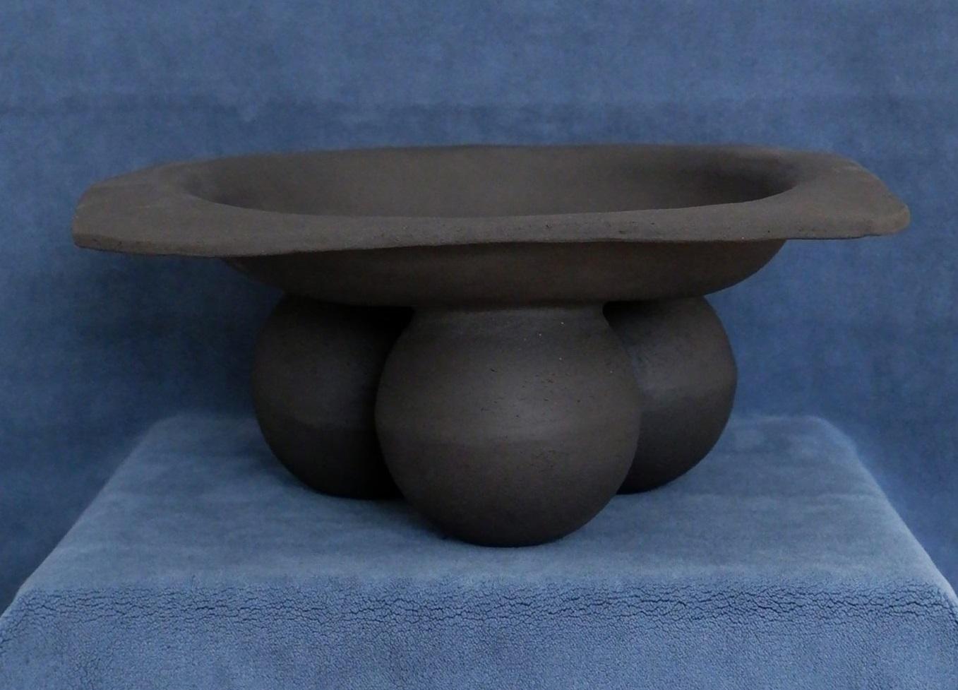 Samaia Fruit Bowl by Ia Kutateladze
One Of  A Kind.
Dimensions: D 29 x W 27 x H 12 cm.
Materials: Raw clay.

Hand-built one of a kind, bold sculptural tableware piece, which could be used as a fruit bowl or platter. The irregular shapes are always