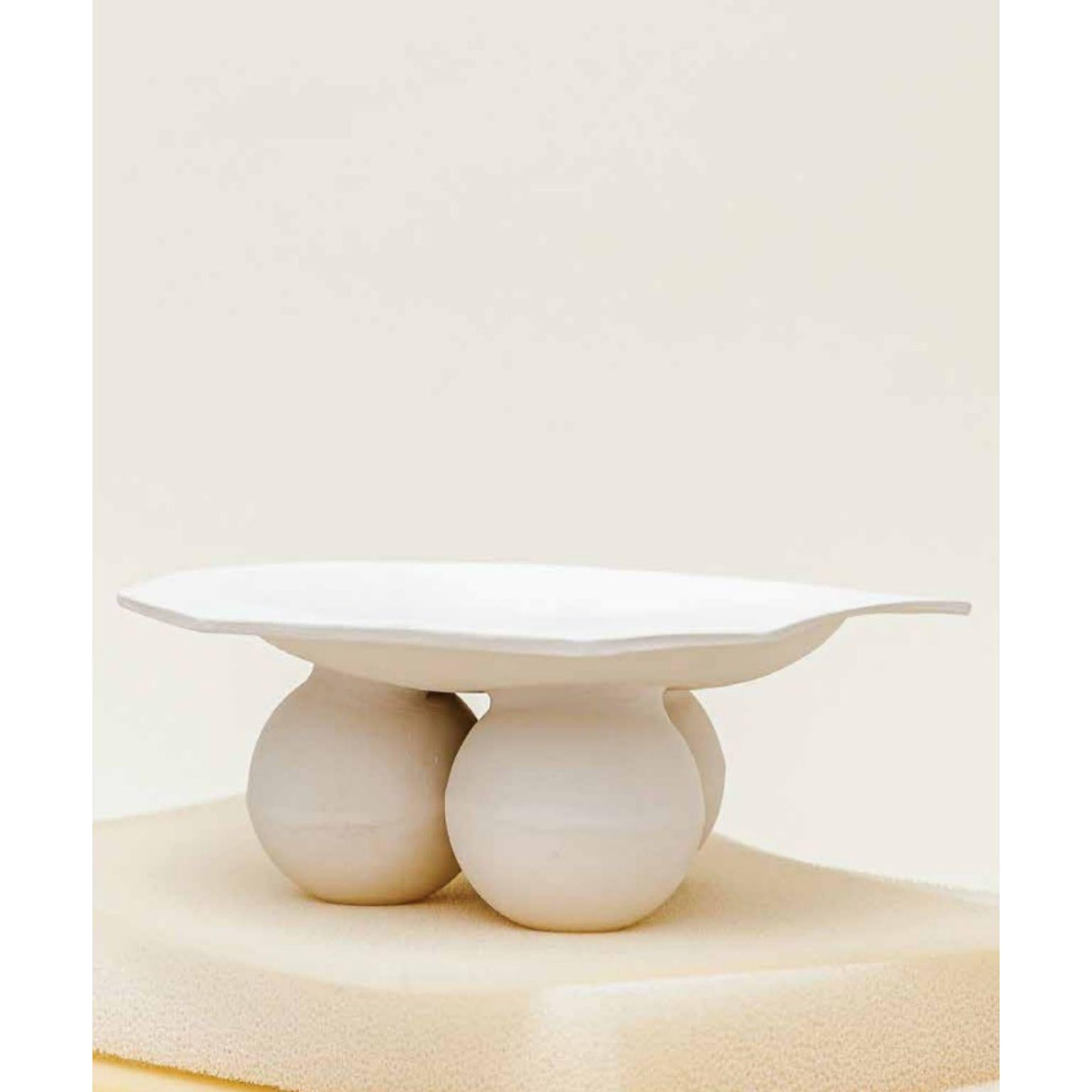 Samaia Fruit Bowl by Ia Kutateladze
One Of  A Kind.
Dimensions: D 29 x W 27 x H 12 cm.
Materials: Raw white clay.

Hand-built one of a kind, bold sculptural tableware piece, which could be used as a fruit bowl or platter. The irregular shapes are