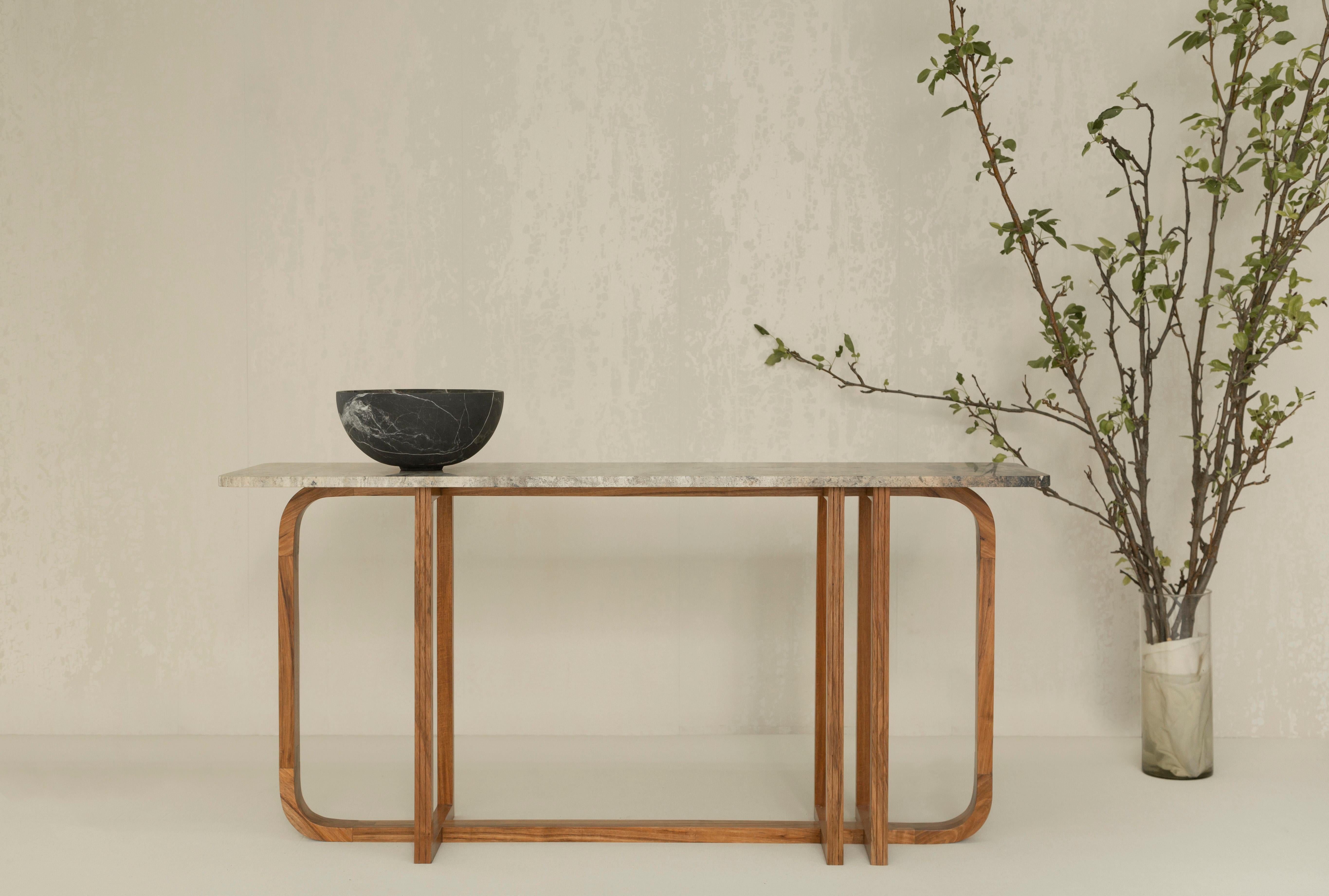 Crafted with precision, the base of the Samara Console Table is meticulously fashioned from Tzalam wood, a Mexican hardwood known for its rich tones and durability. The top, a stunning terracotta travertine marble, not only complements the wood base